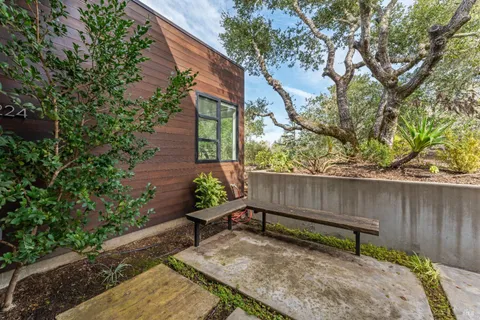 a view of a bench in the backyard
