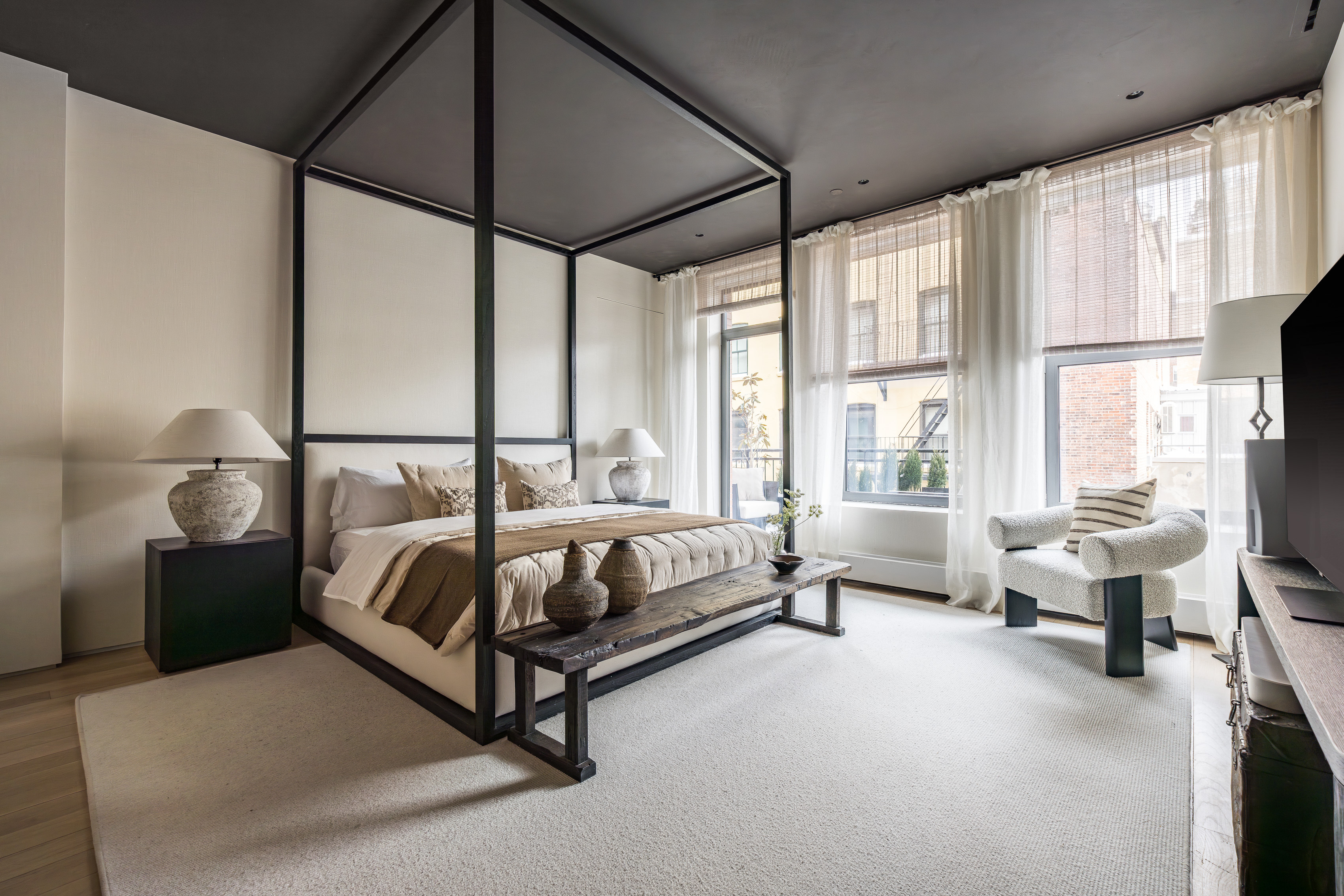 415 Washington Street, Unit 5A Manhattan, NY 10013 - Photo 10 of 21 a spacious bedroom with a bed and a large window