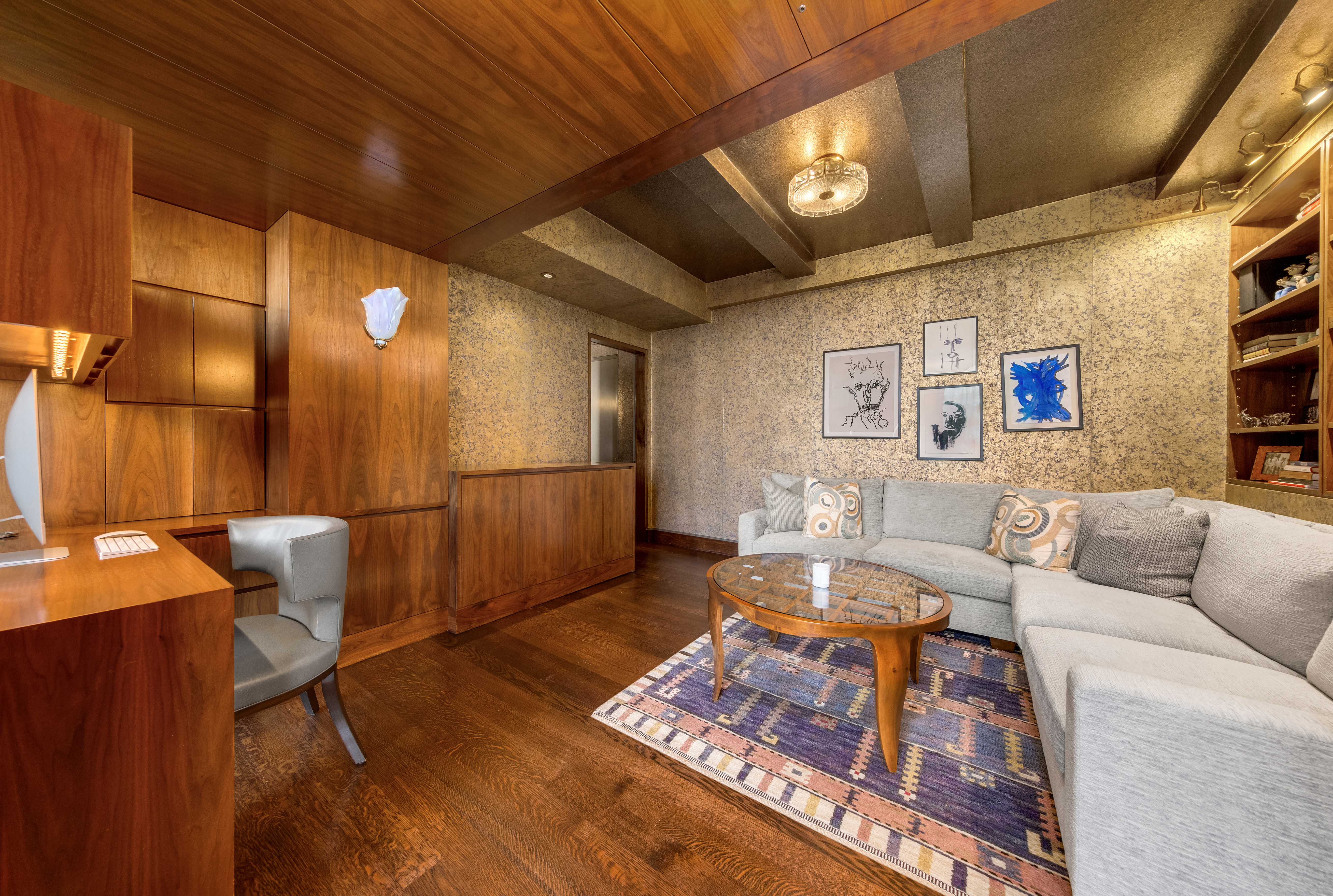 1 West 67th Street, Unit 606607 Manhattan, NY 10023 - Photo 10 of 15 a living room with furniture and a table