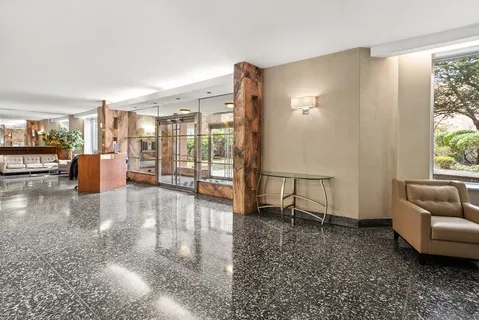 a view of livingroom with furniture and floor to ceiling window