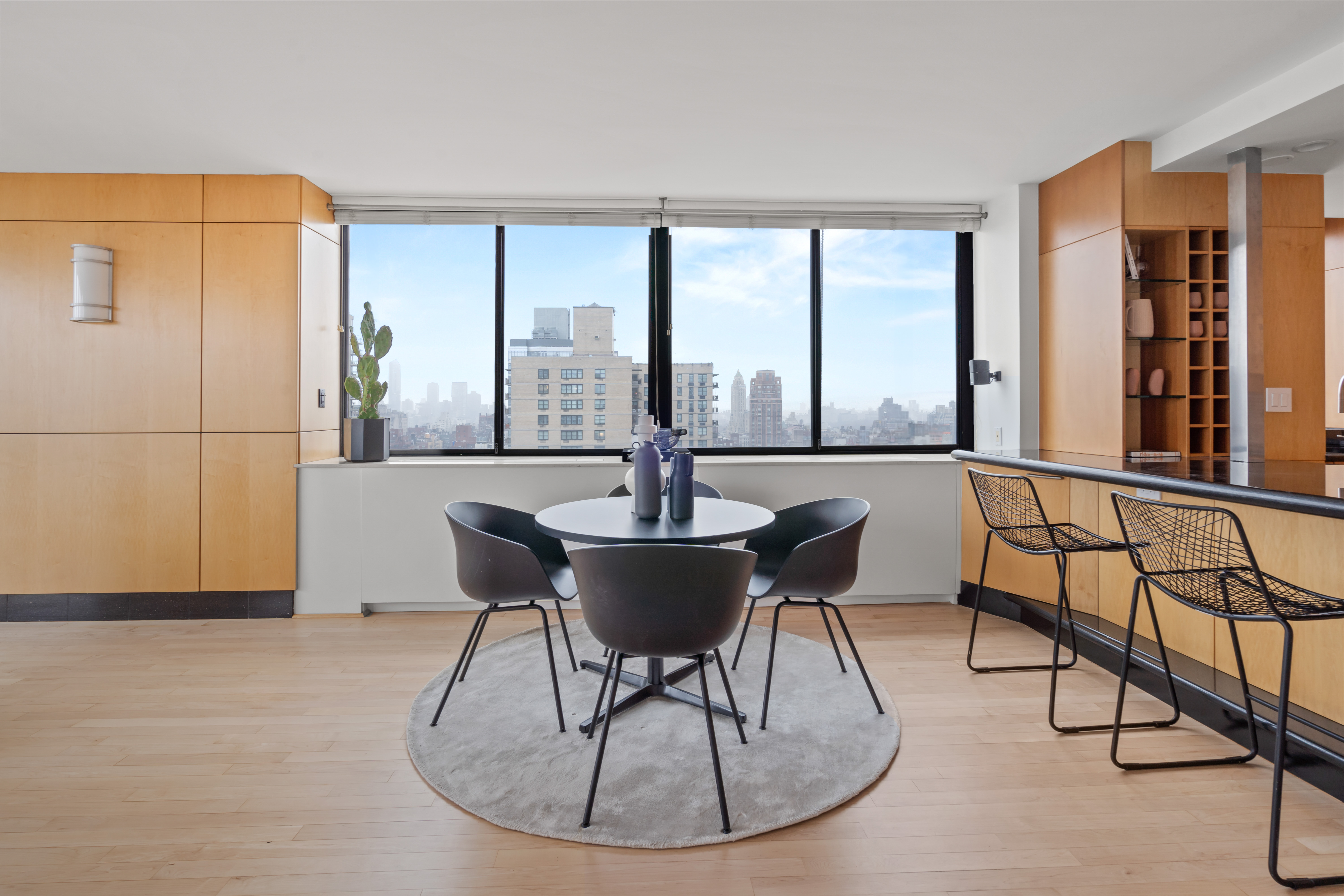 330 East 75th Street, Unit 32A Manhattan, NY 10021 - Photo 5 of 17 a dining room with furniture and window