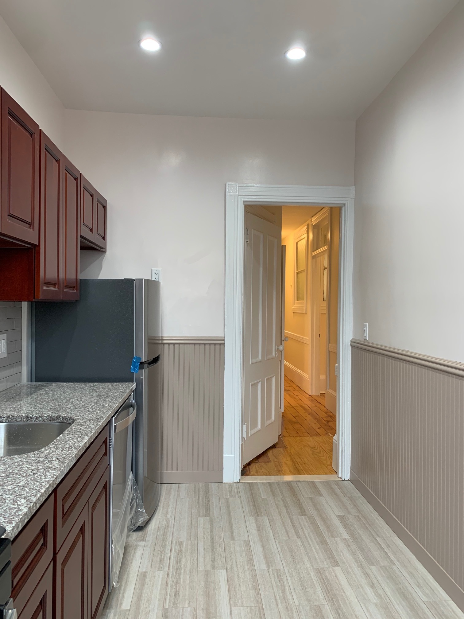 481 9th Street, Unit 4 Brooklyn, NY 11215 - Photo 25 of 33 a kitchen with granite countertop a sink cabinets and a wooden floor