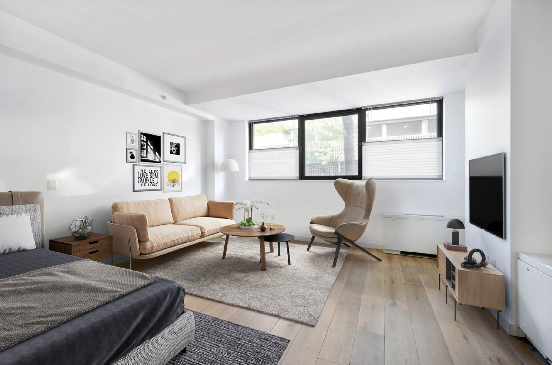 a living room with furniture and a flat screen tv