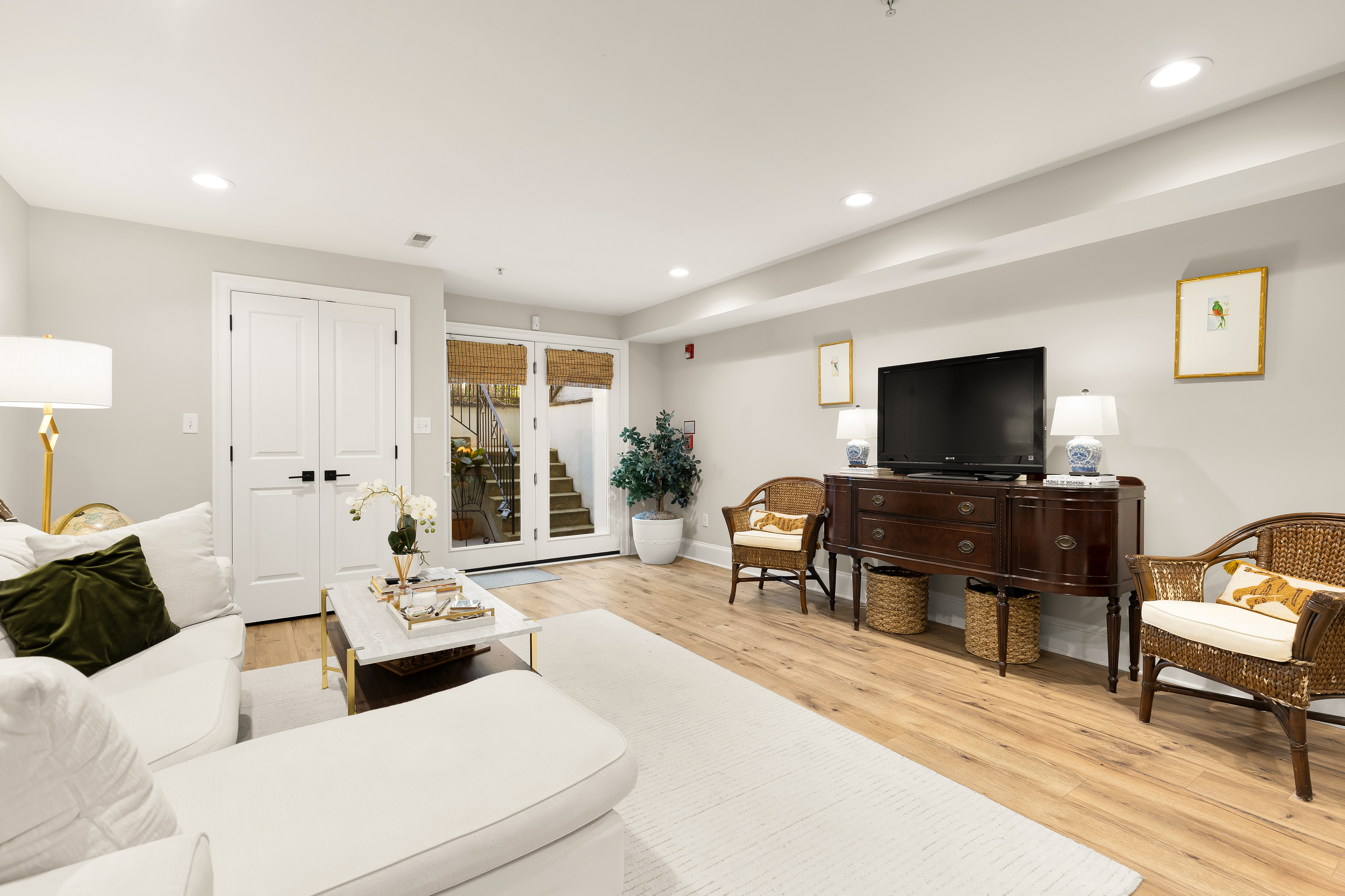 1354 Kenyon Street Northwest, Unit G Washington, DC 20010 - Photo 8 of 35 a living room with furniture and a flat screen tv