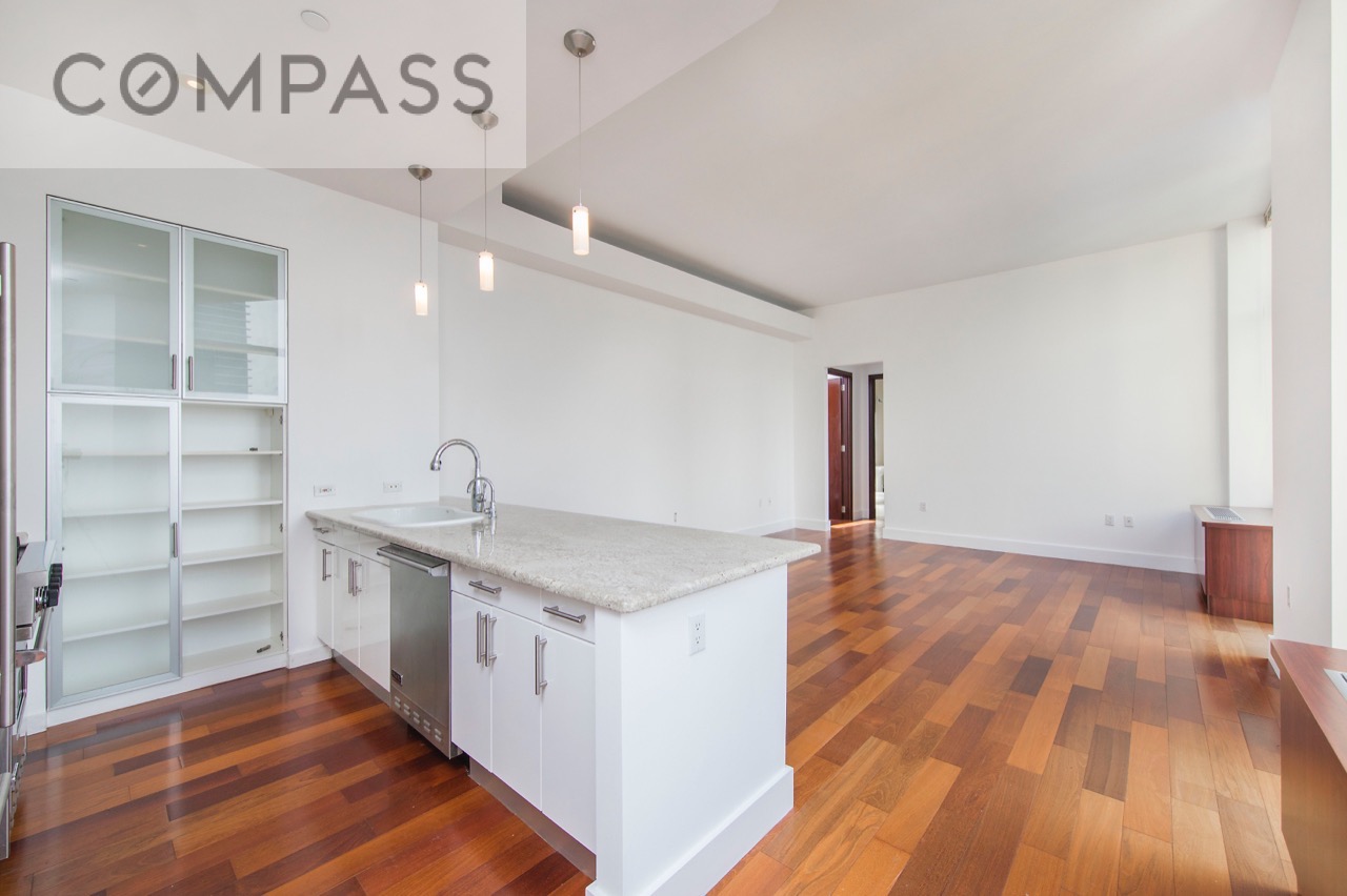 42-51 Hunter Street, Unit 3D Queens, NY 11101 - Photo 2 of 14 a kitchen with a sink and cabinets