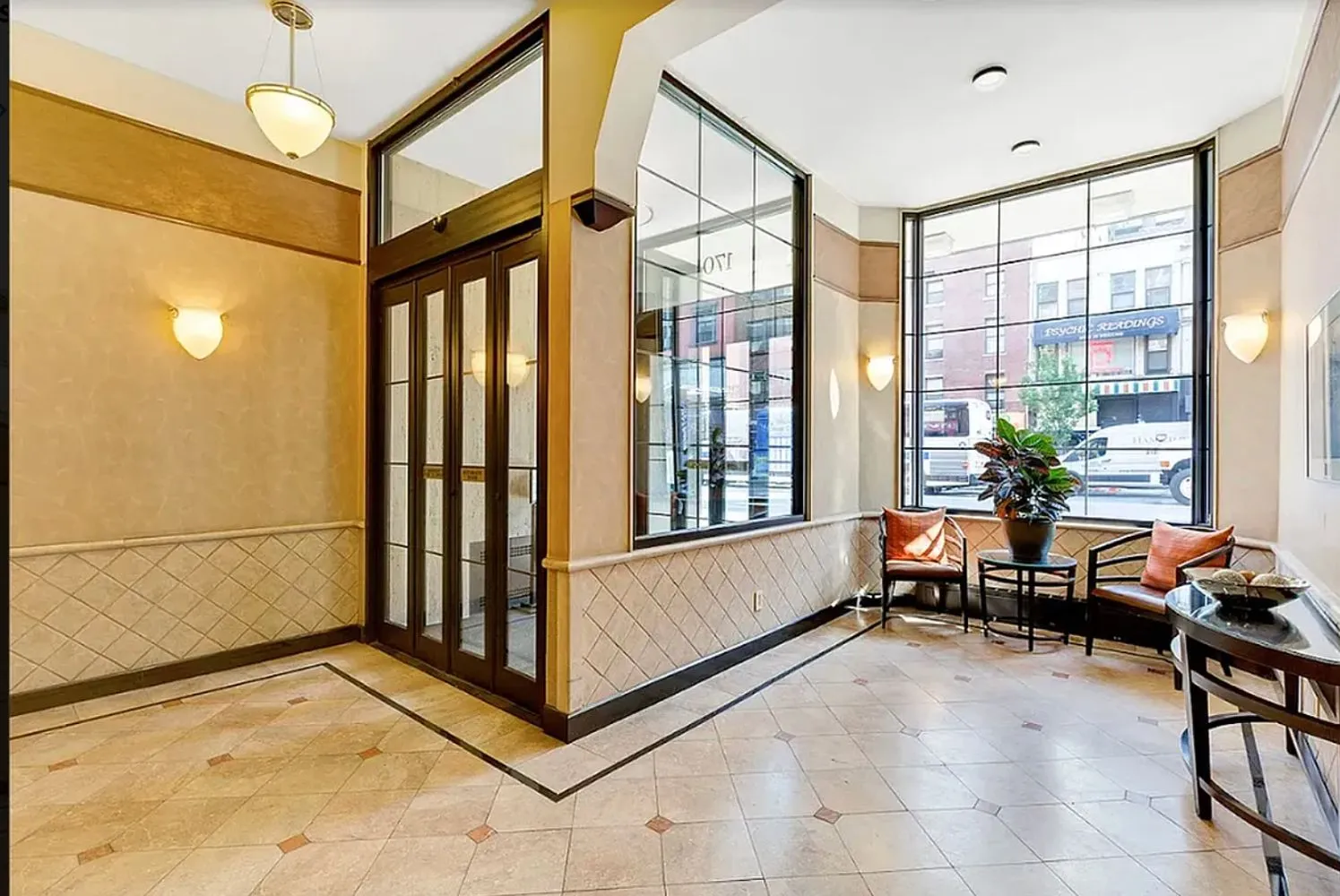 a very nice looking room with a large window and furniture