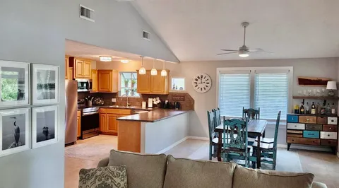 a kitchen with stainless steel appliances granite countertop a stove and a refrigerator