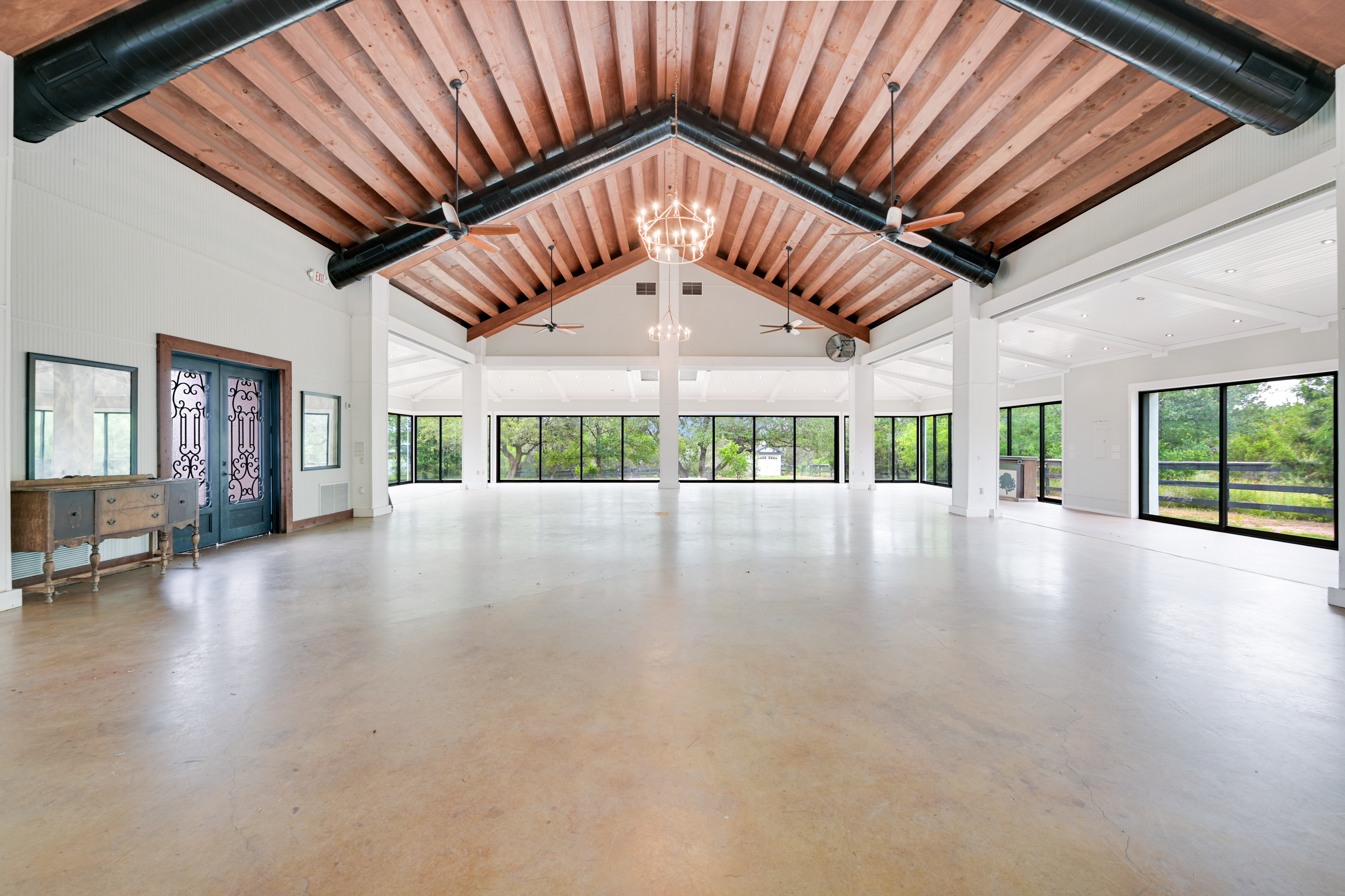 14913 Murfin Road Austin, TX 78734 - Photo 2 of 40 a view of an empty room with a window and wooden floor