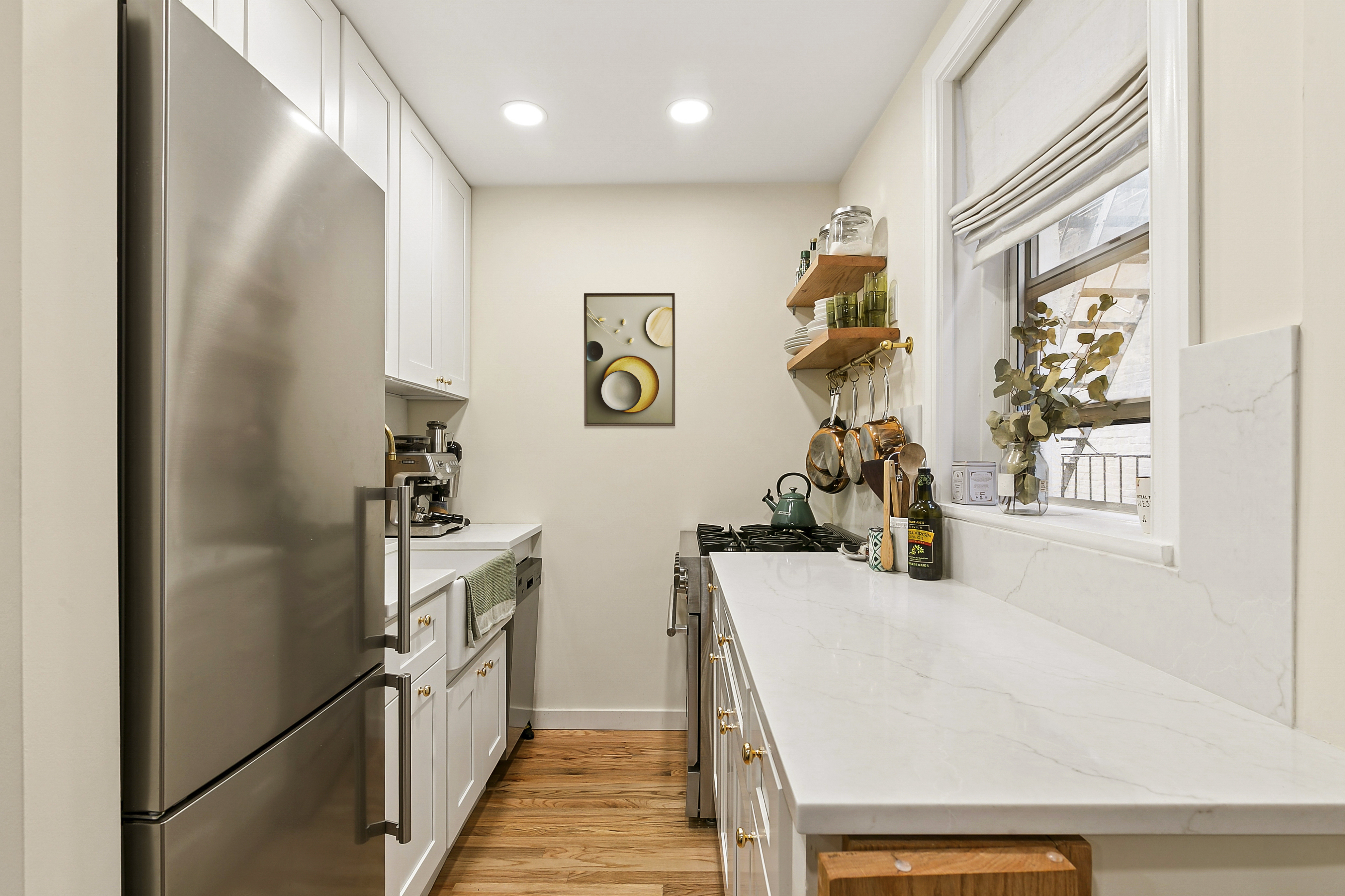 446 Central Park West, Unit 6D Manhattan, NY 10025 - Photo 2 of 9 a view of a kitchen and utility room
