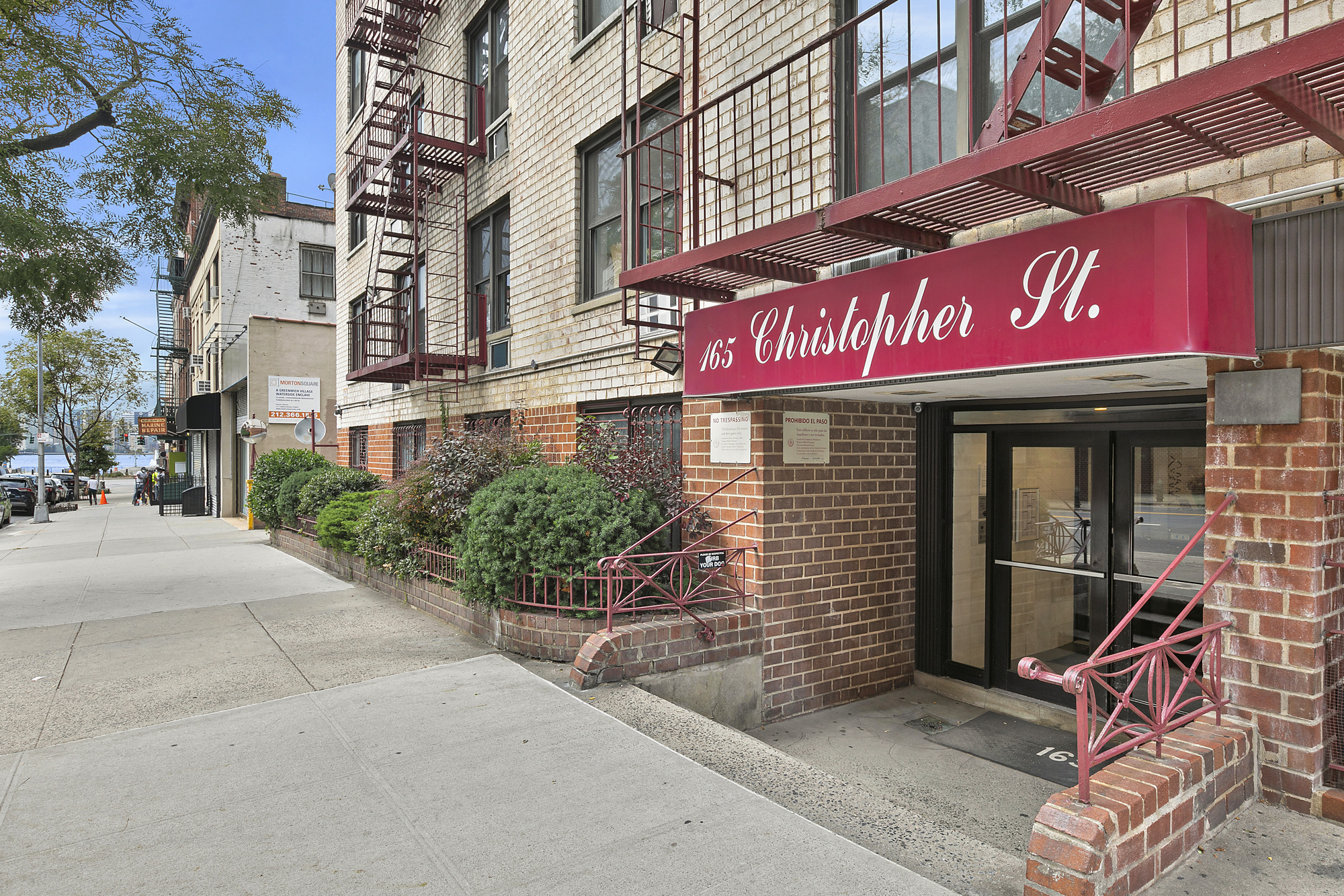 165 Christopher Street, Unit 5AA Manhattan, NY 10014 - Photo 8 of 9 a cafe on the corner of a street