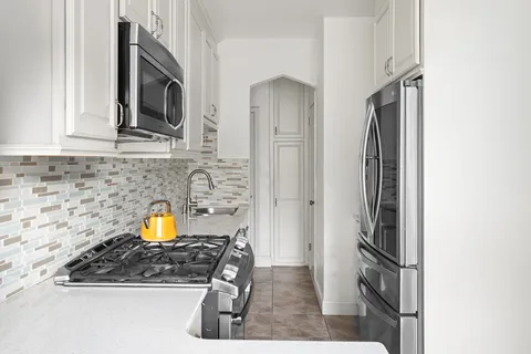 a view of a kitchen with a sink