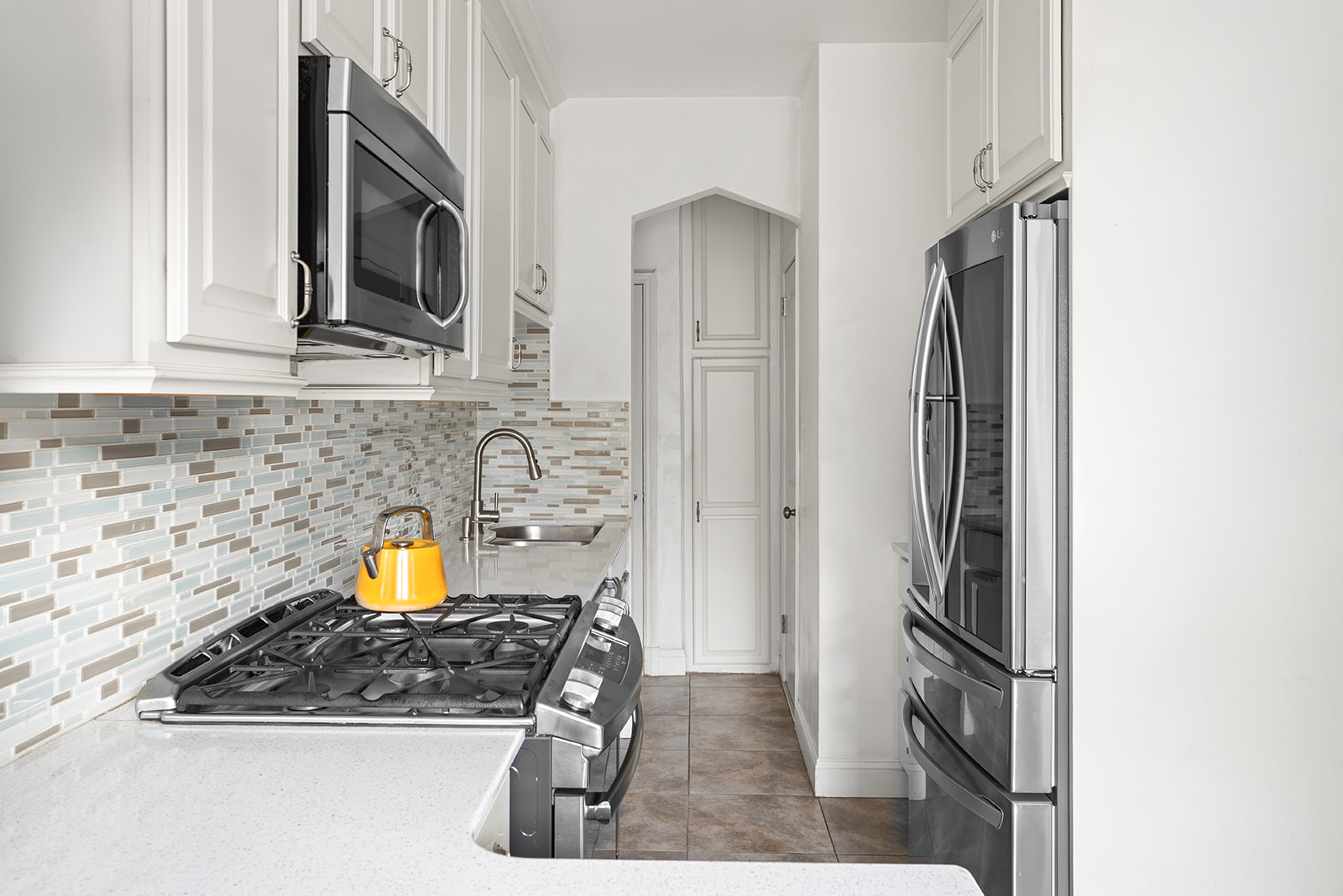30-22 88th Street Queens, NY 11369 - Photo 5 of 14 a view of a kitchen with a sink