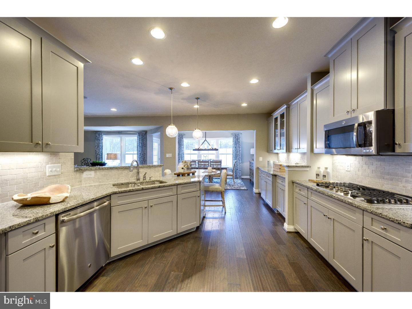 407 Quarry Point Road Malvern, PA 19355 - Photo 6 of 14 a large kitchen with stainless steel appliances lots of counter space and a sink