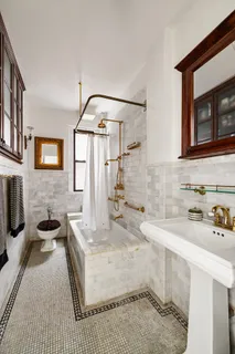 a bathroom with a sink a granite counter and a mirror