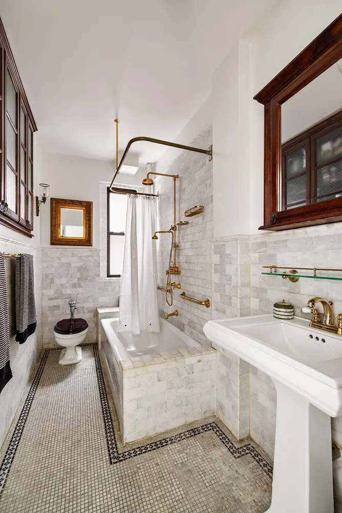 a bathroom with a sink a granite counter and a mirror