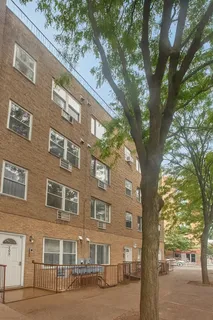 a large building with a trees in front of it