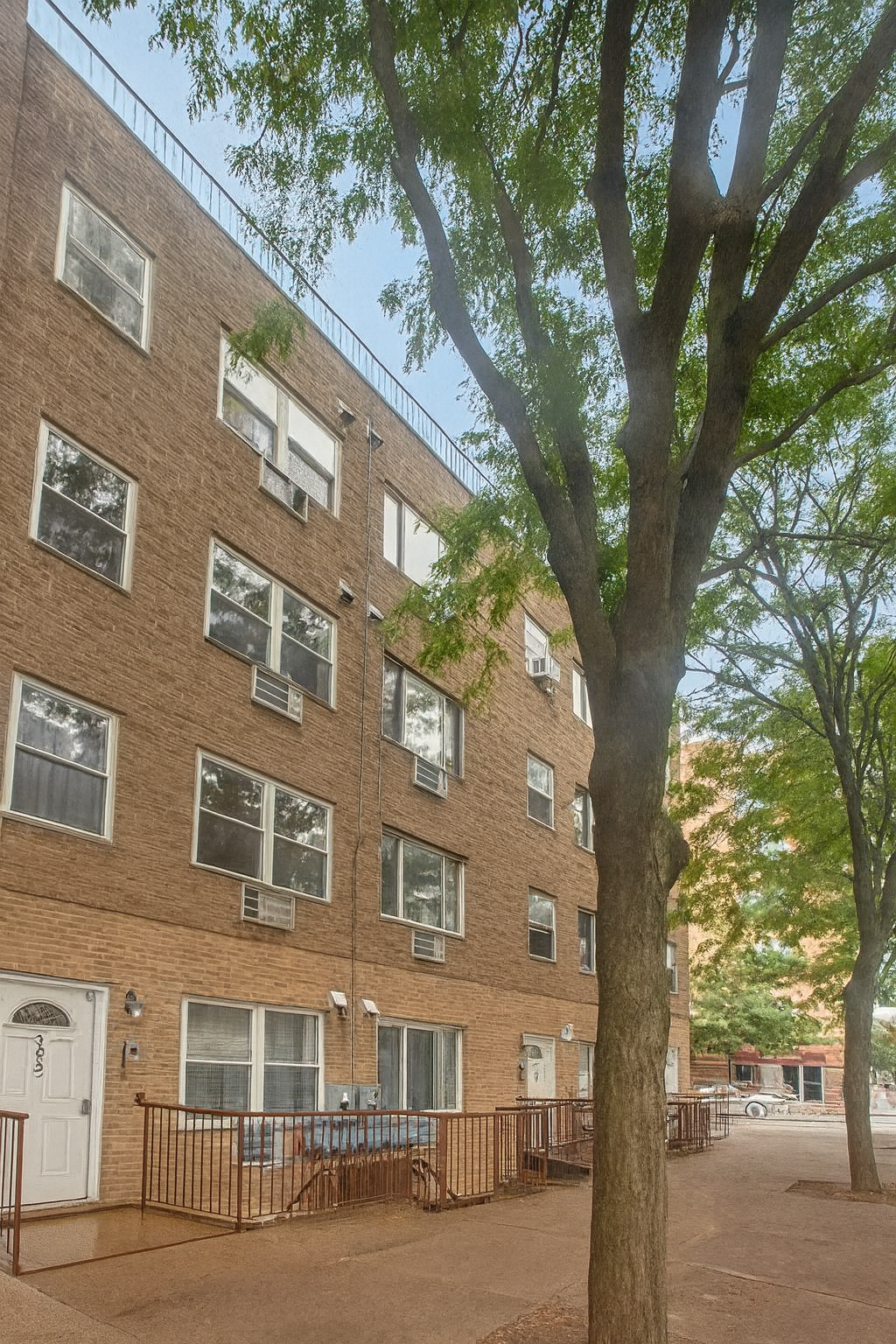a large building with a trees in front of it