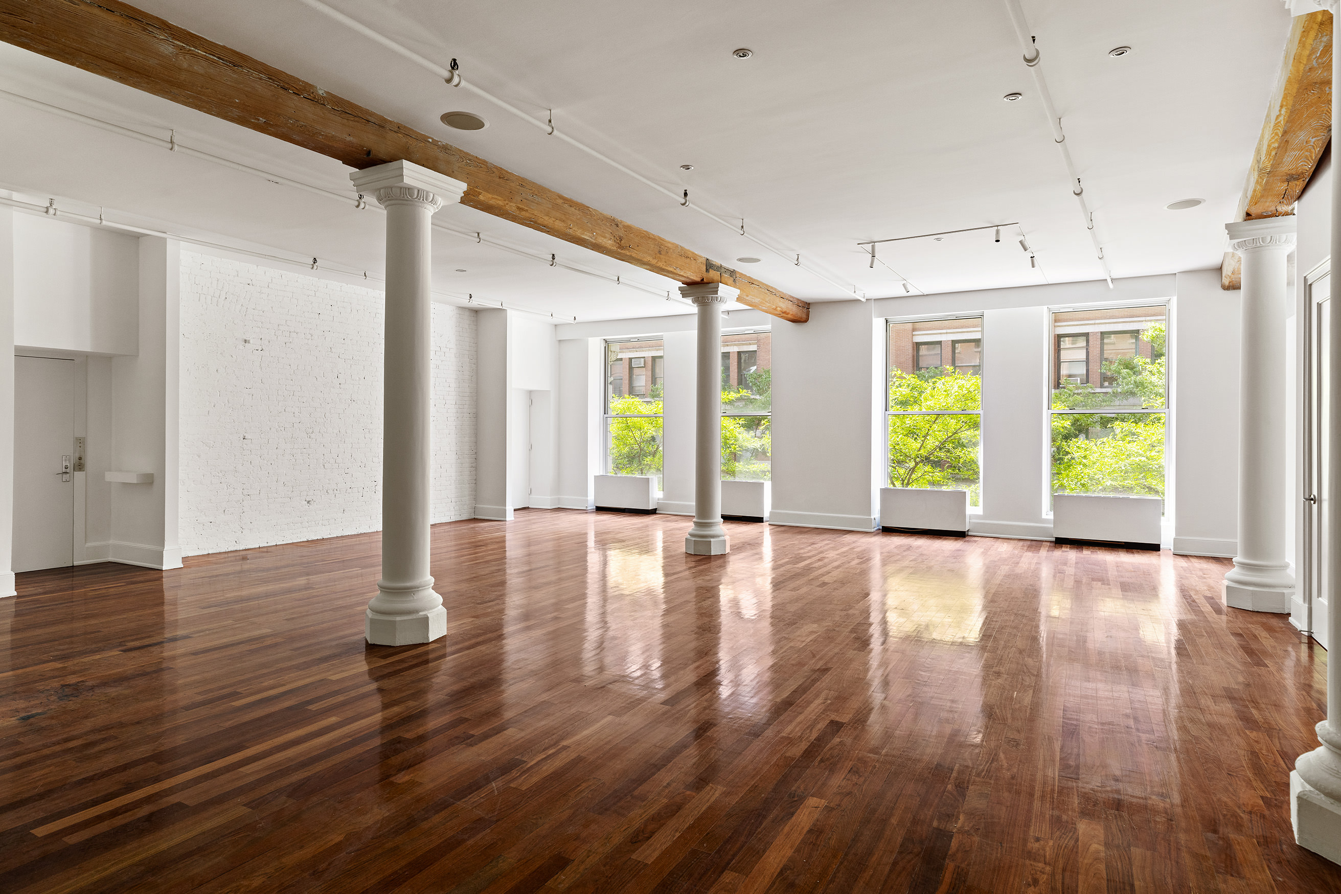 285 Lafayette Street, Unit 2B Manhattan, NY 10012 - Photo 2 of 19 a view of an empty room with wooden floor and a window