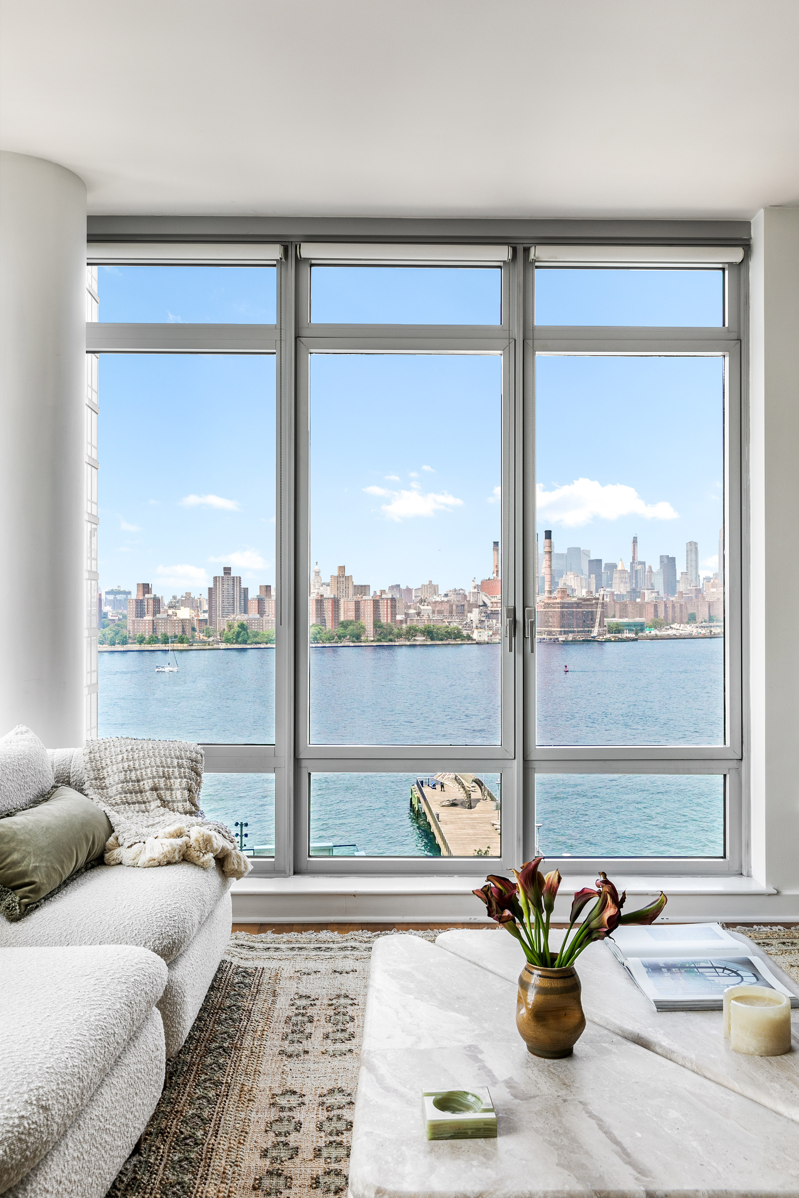 a living room filled with furniture and a window