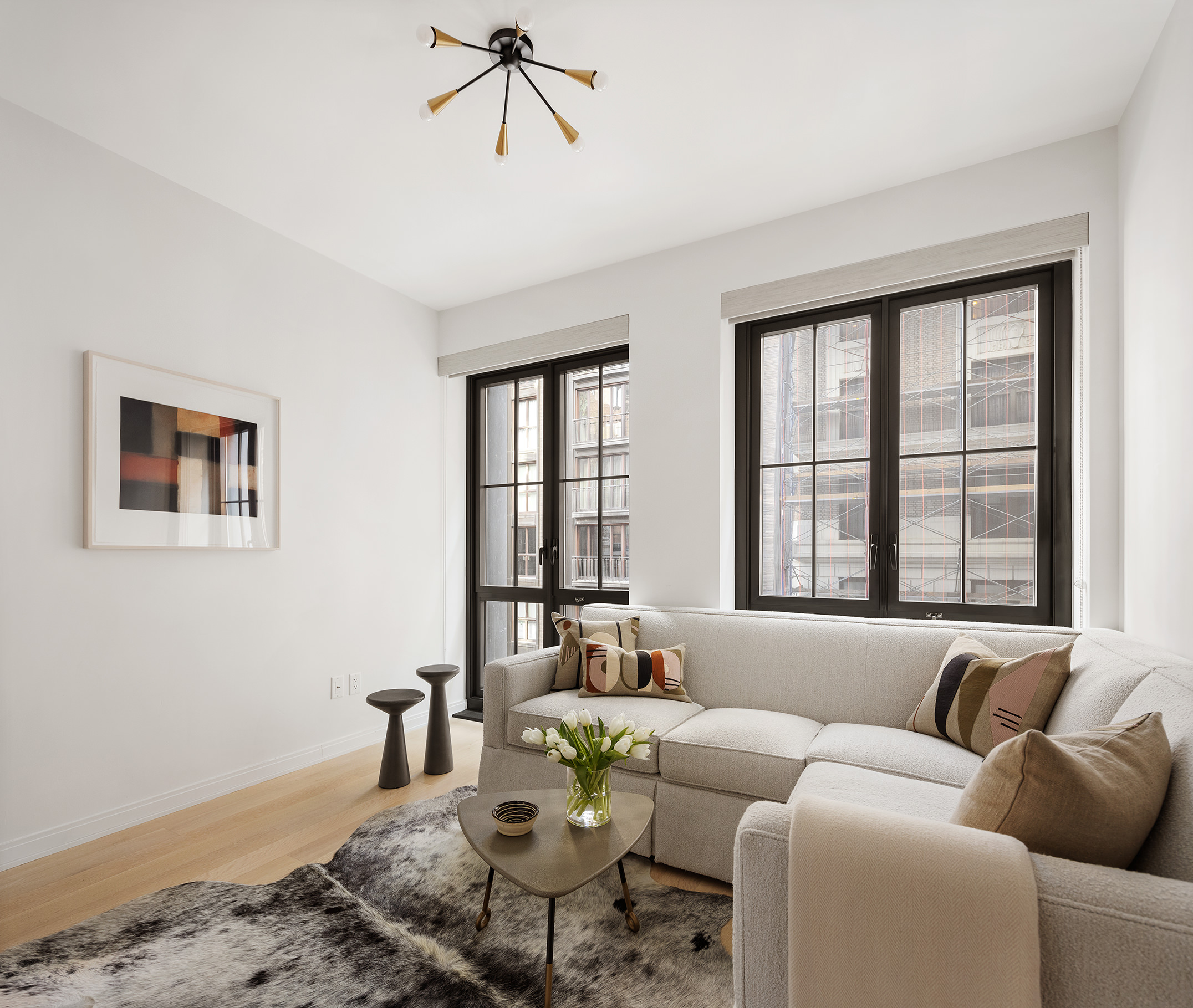 221 West 77th Street, Unit 4E Manhattan, NY 10024 - Photo 5 of 20 a living room with furniture and floor to ceiling windows