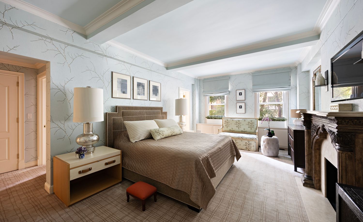 a bedroom with a bed couch and a view of bedroom