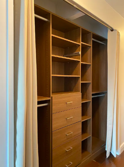 301 West 57th Street, Unit 22D Manhattan, NY 10019 - Photo 6 of 12 a view of walk in closet with empty racks