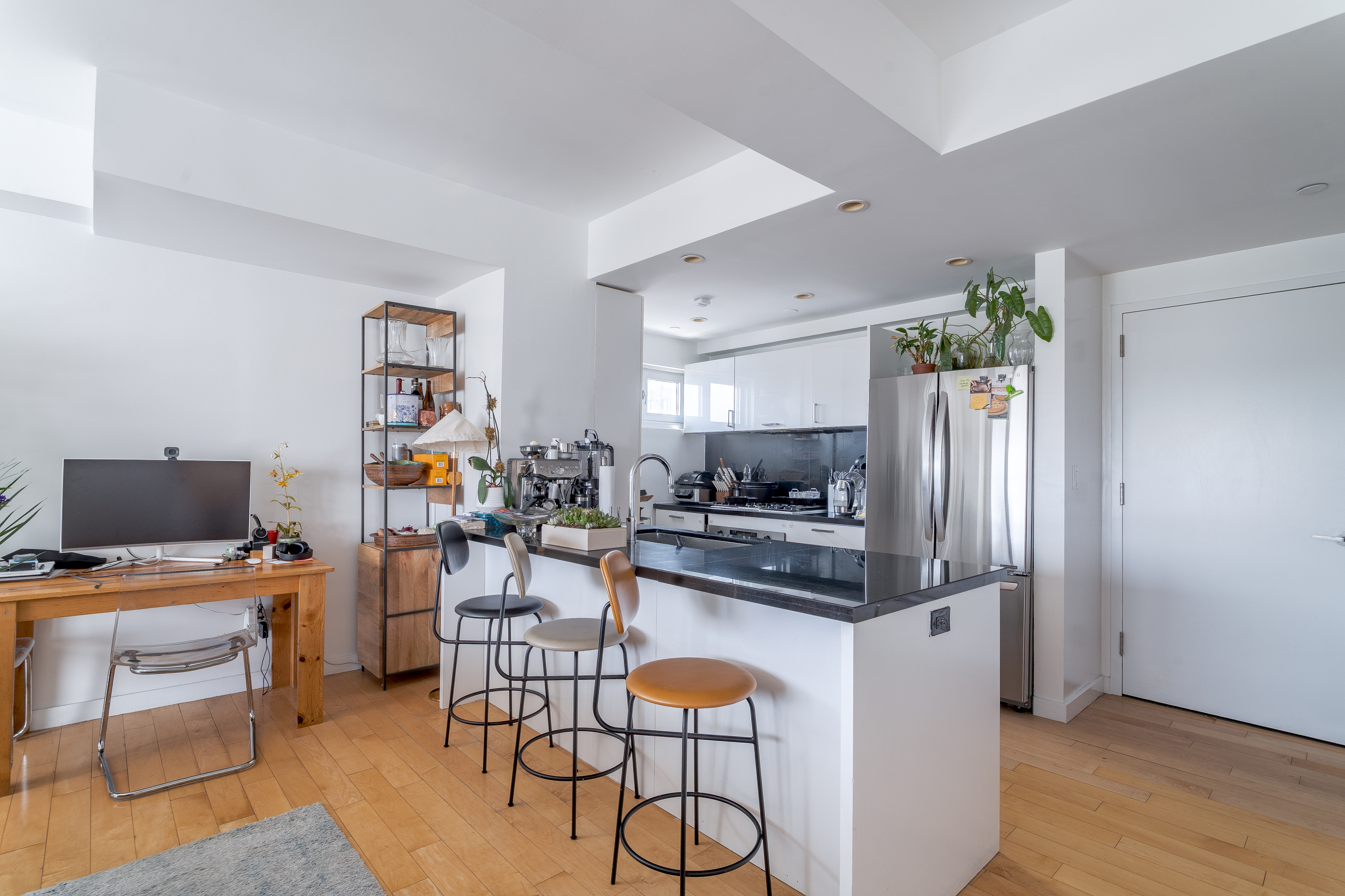 560 Carroll Street, Unit 11A Brooklyn, NY 11215 - Photo 4 of 13 a kitchen with stainless steel appliances a stove a refrigerator and a dining table