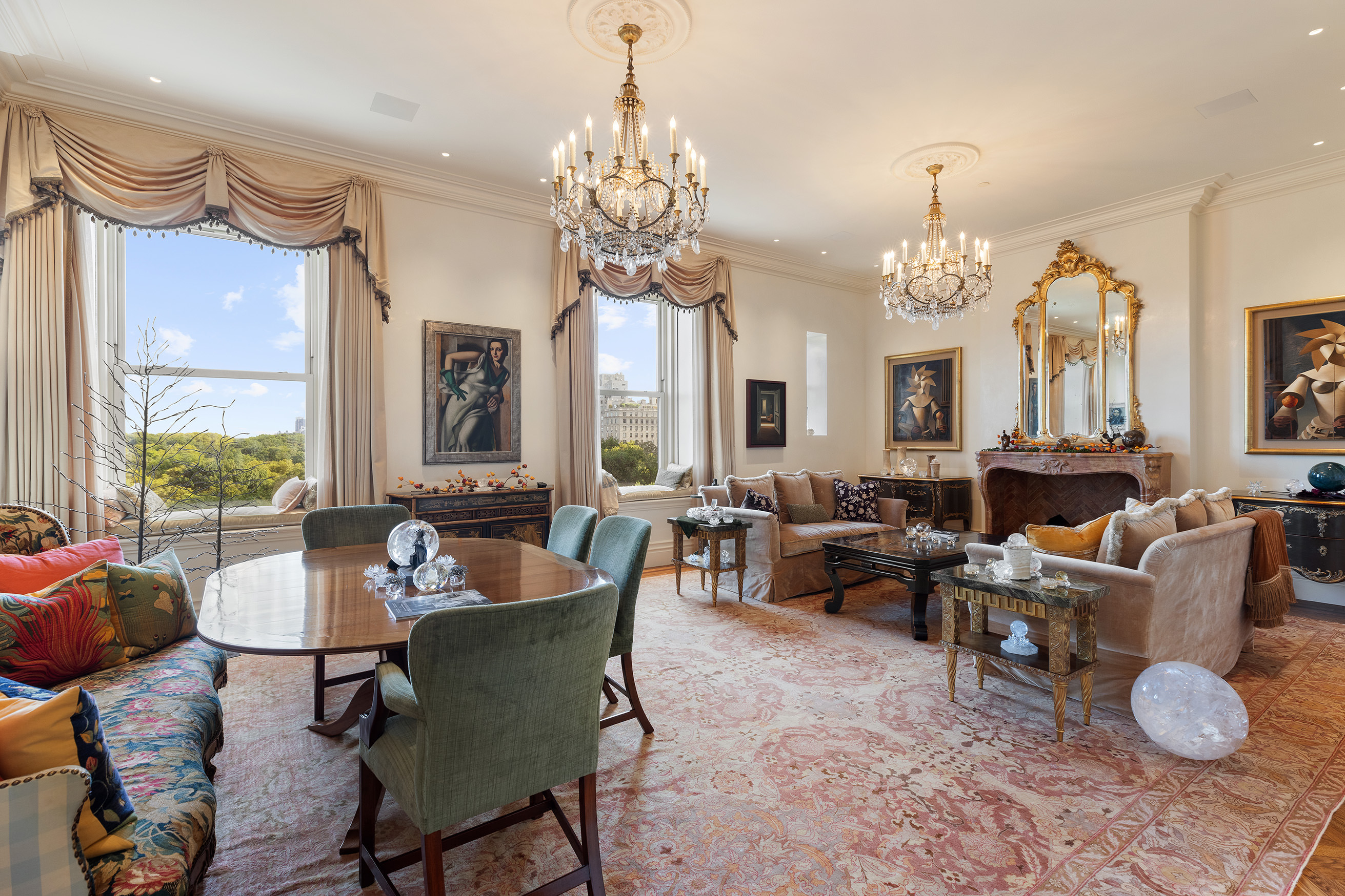 1 Central Park South, Unit 8010203 Manhattan, NY 10019 - Photo 4 of 45 a living room with furniture chandelier and a fireplace