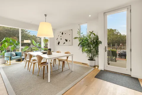 a view of a dining room with furniture window and outside view