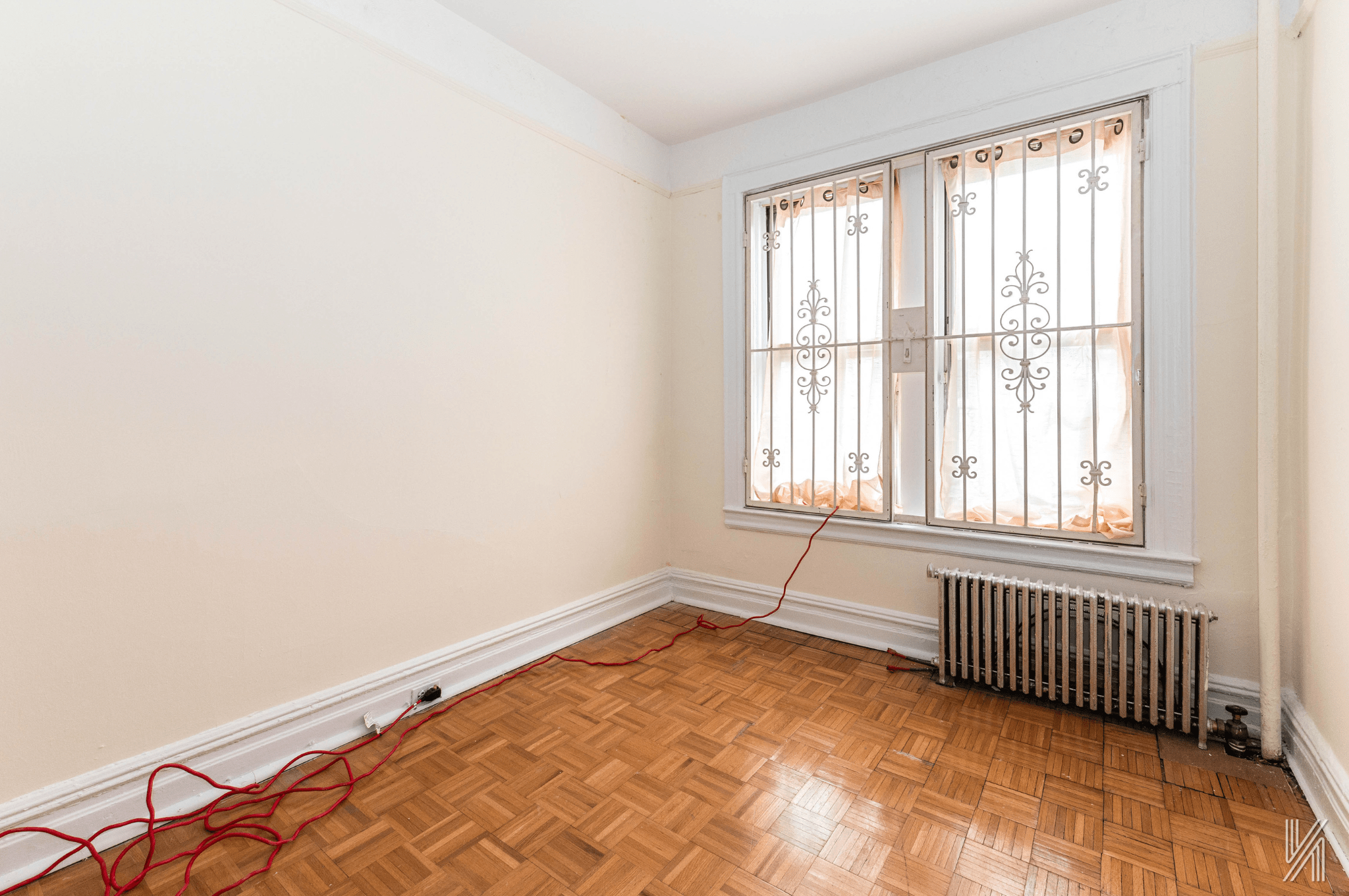 32-10 35th Street Queens, NY 11106 - Photo 14 of 29 an empty room with a window