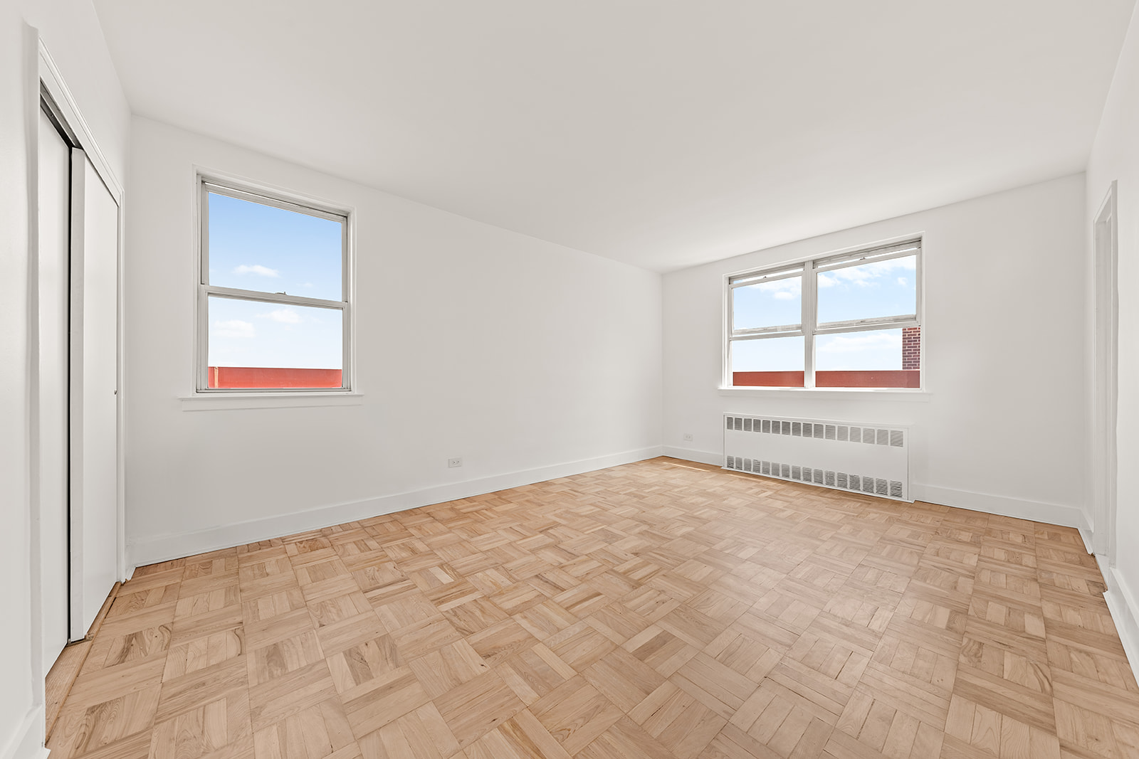 110-50 71st Road, Unit PHD Queens, NY 11375 - Photo 13 of 14 a view of a bedroom with a bed and a window