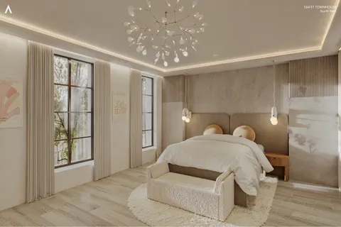 a spacious bedroom with a bed and a chandelier