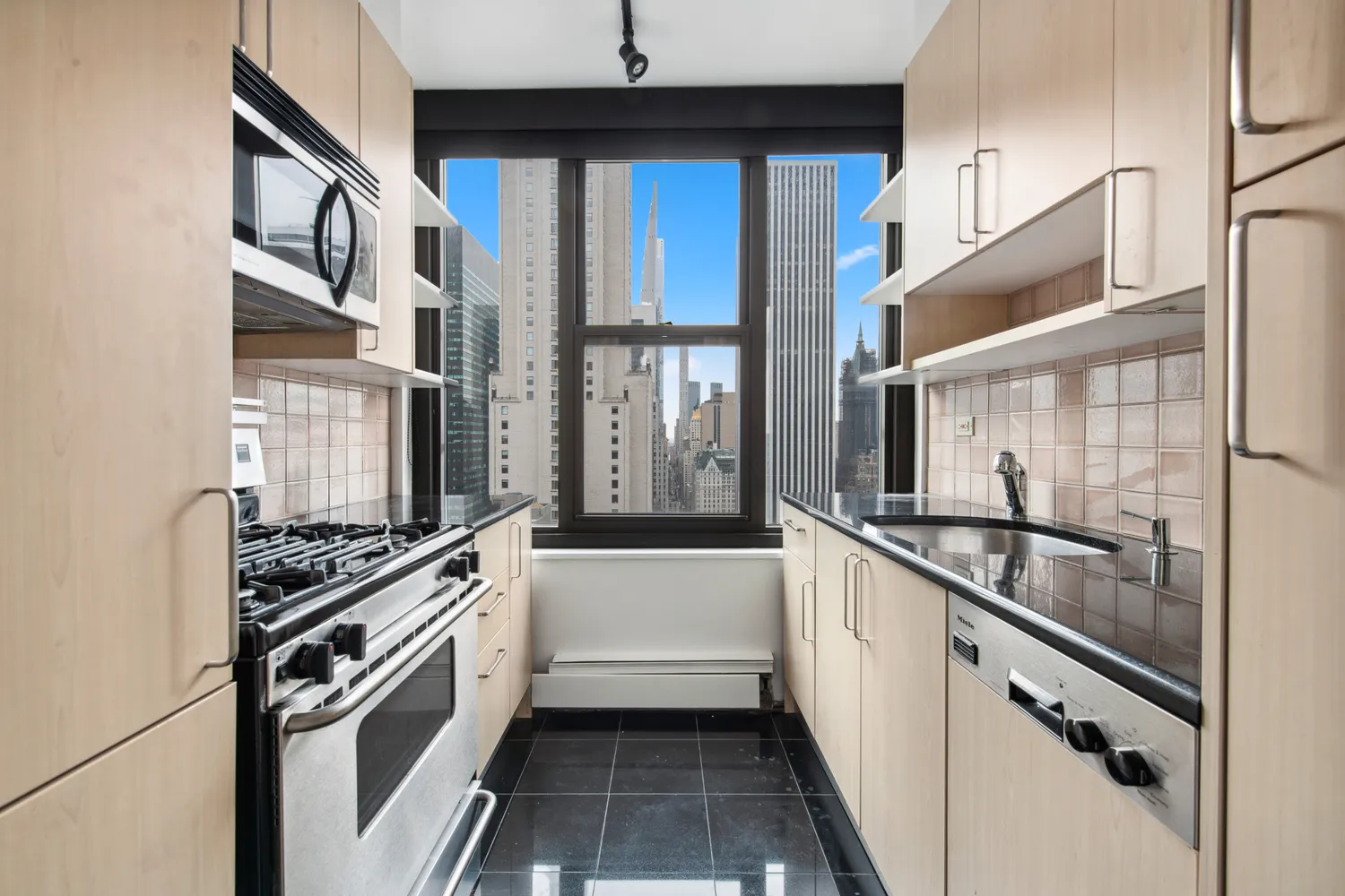 a kitchen with a stove a refrigerator and cabinets