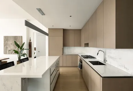 a kitchen with stainless steel appliances a sink a stove and a refrigerator