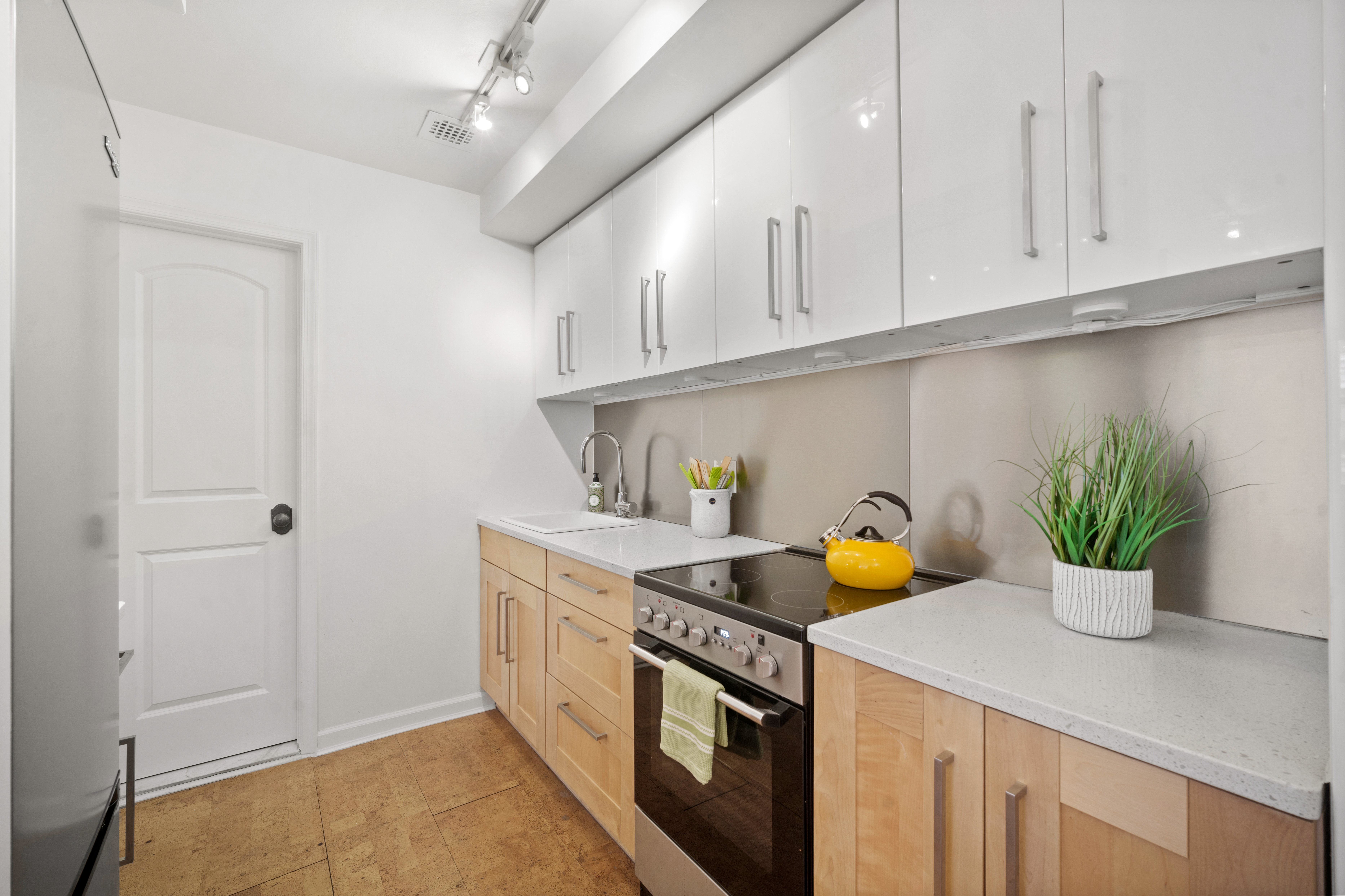 22 Irving Place, Unit 4E Manhattan, NY 10003 - Photo 5 of 8 a kitchen with a sink and cabinets