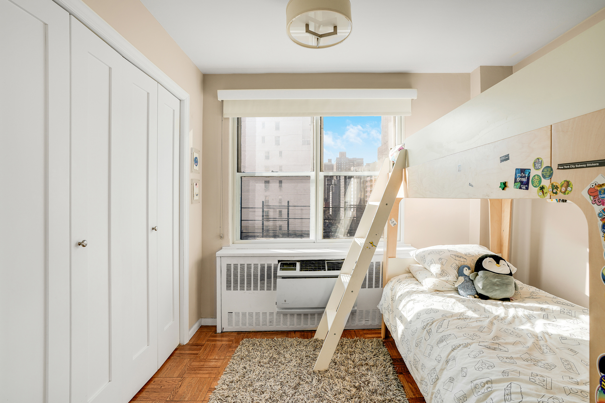 201 East 37th Street, Unit 11D Manhattan, NY 10016 - Photo 9 of 11 a bedroom with furniture and a window