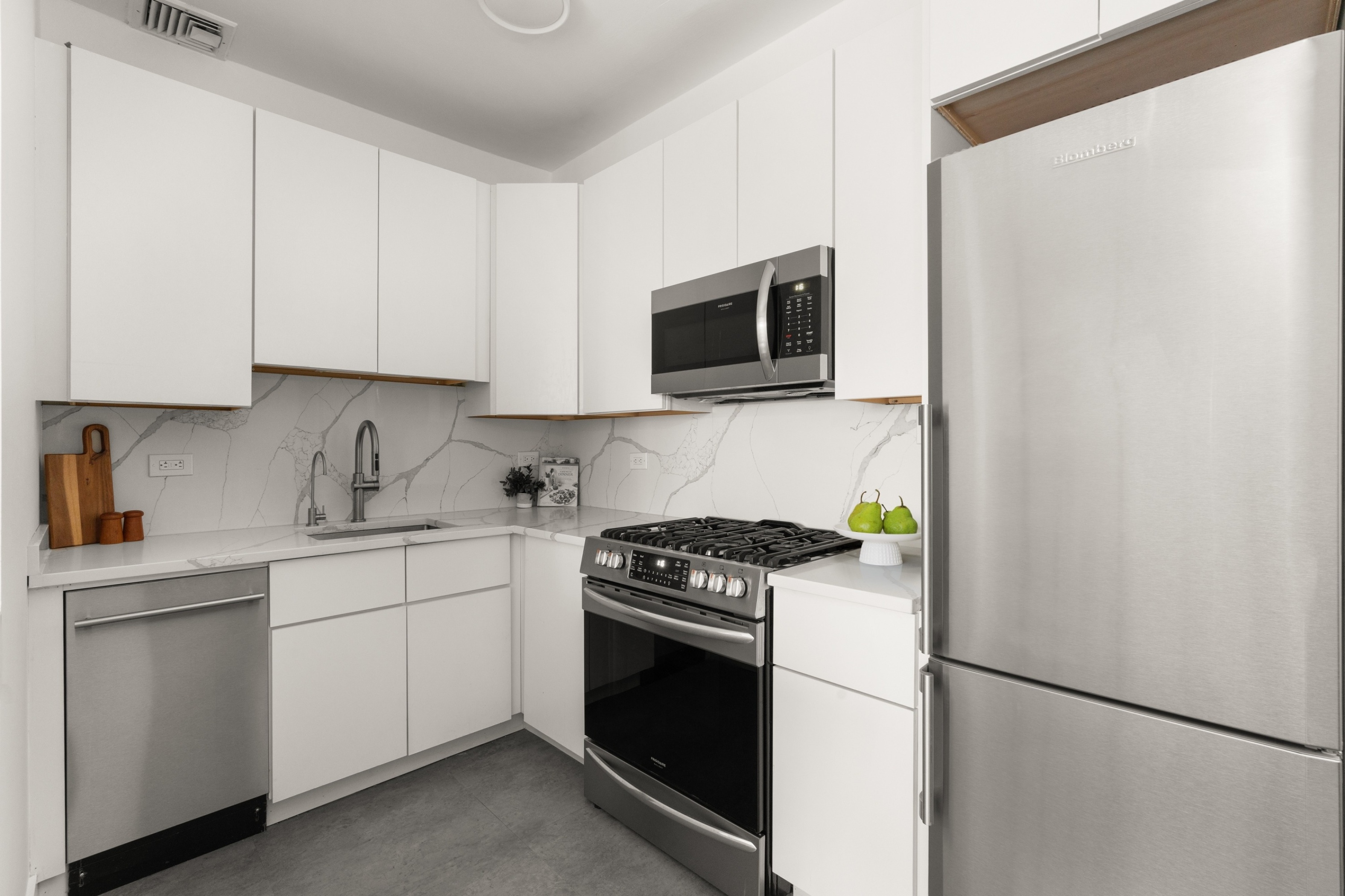 40 Clinton Street, Unit 1M Brooklyn, NY 11201 - Photo 6 of 8 a kitchen with a refrigerator stove and microwave