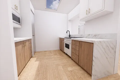 a kitchen with stainless steel appliances granite countertop a stove and a sink
