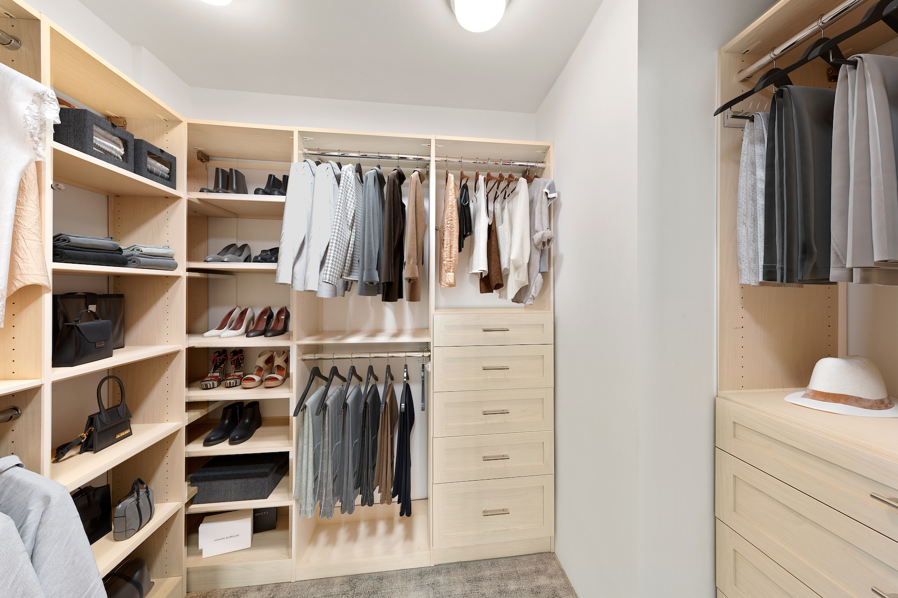 110 East 57th Street, Unit 10CD Manhattan, NY 10022 - Photo 9 of 16 a view of walk in closet with clothes and shoes