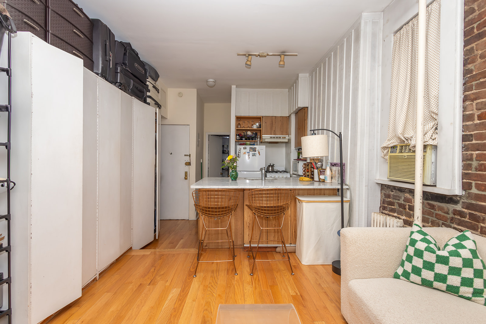 147 Sullivan Street, Unit 2A Manhattan, NY 10012 - Photo 3 of 8 a large kitchen with a table and chairs
