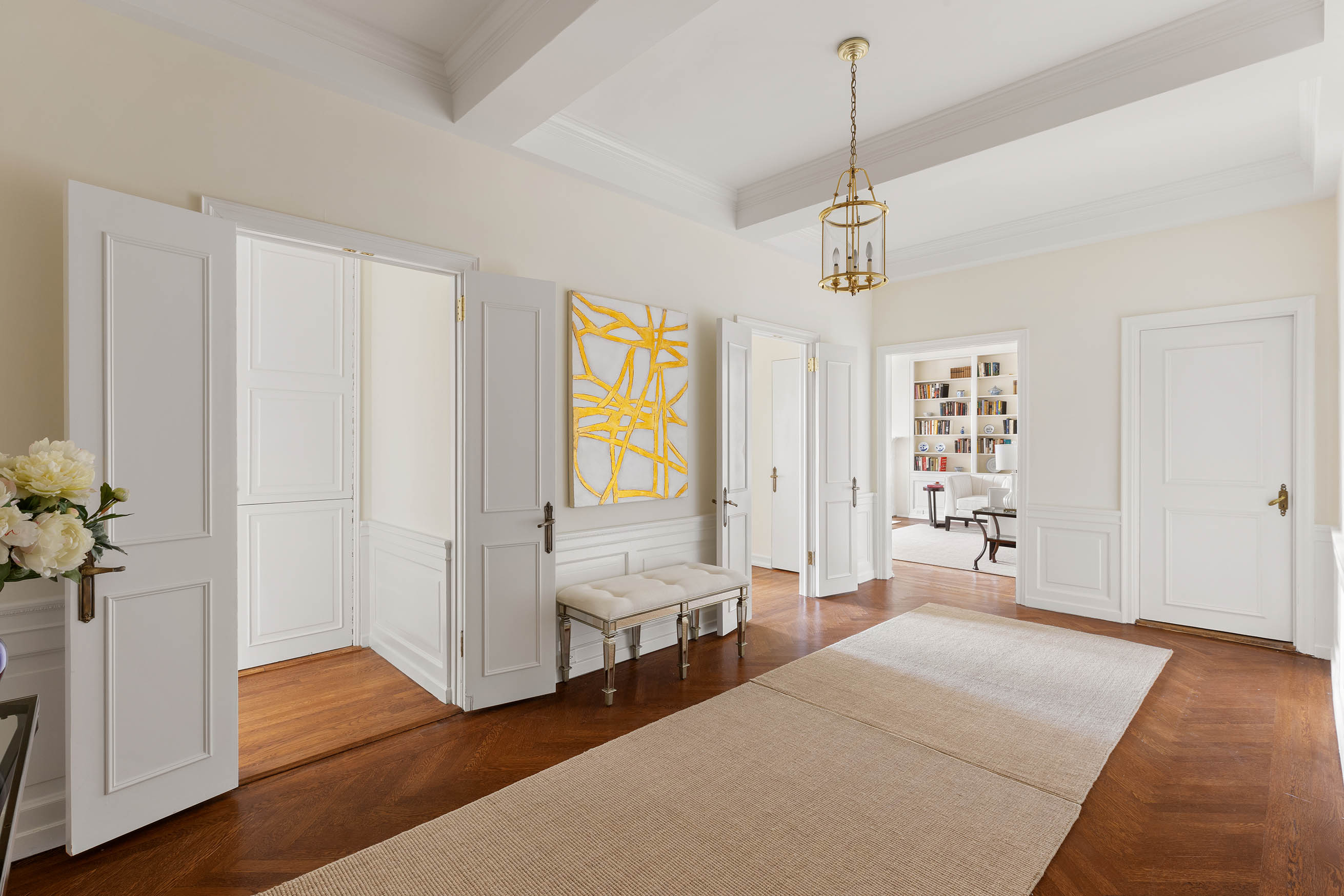33 East 70th Street, Unit 9C Manhattan, NY 10021 - Photo 5 of 12 a spacious bedroom with a bed and a window