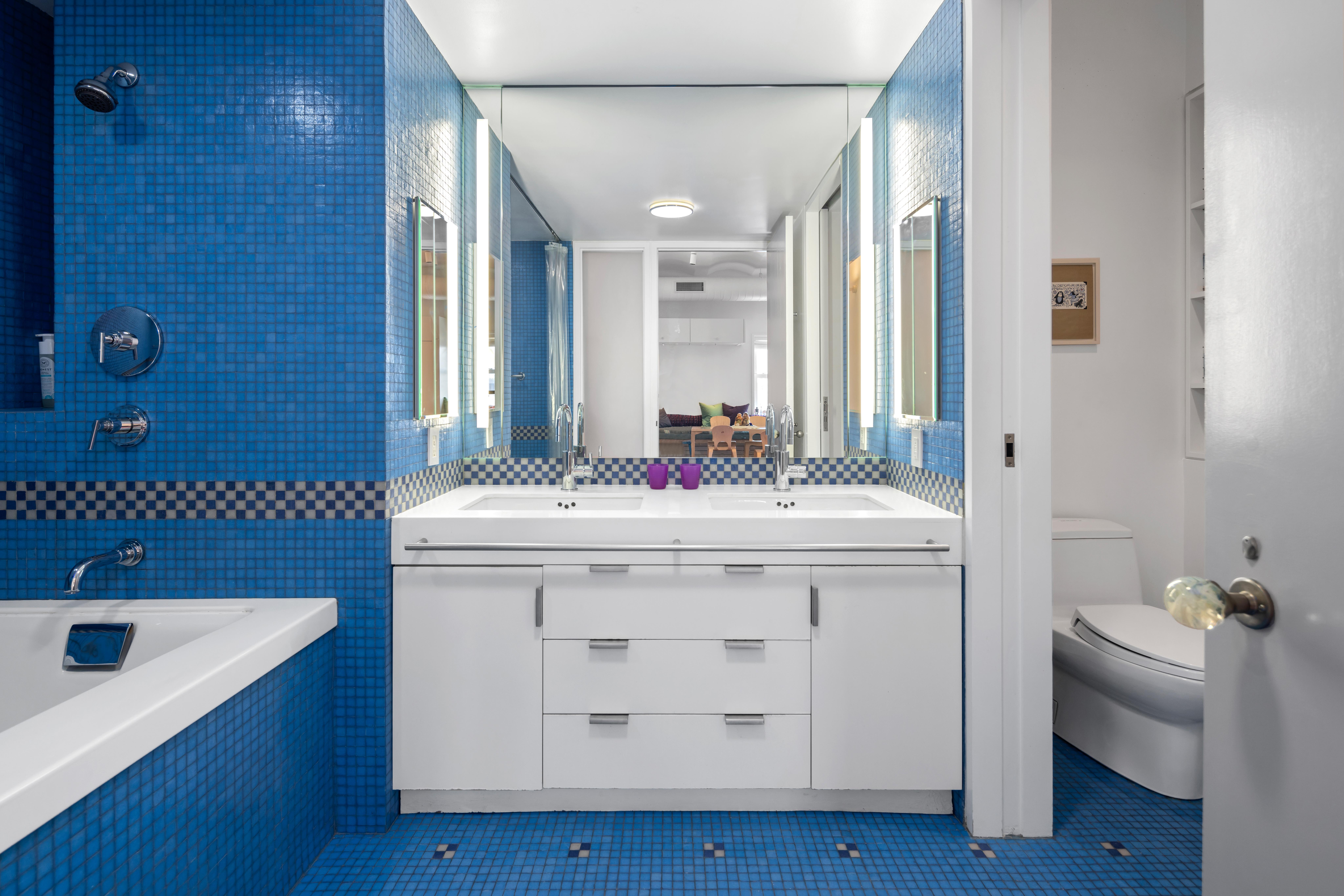 257 West 17th Street, Unit 7AB Manhattan, NY 10011 - Photo 15 of 21 a bathroom with a sink double vanity and a mirror