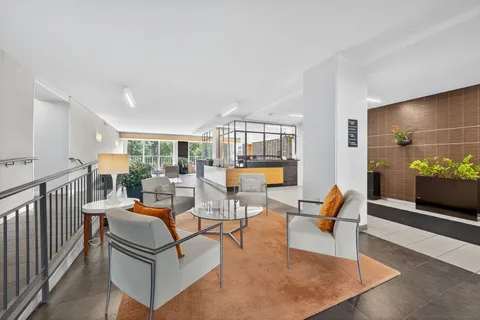 a living room with furniture and a table