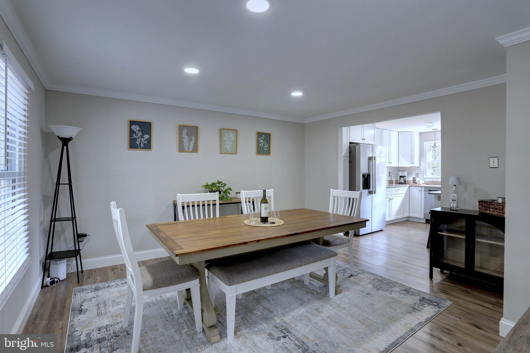 6257 Fairbourne Court Hanover, MD 21076 - Photo 20 of 47 a living room with furniture and a table