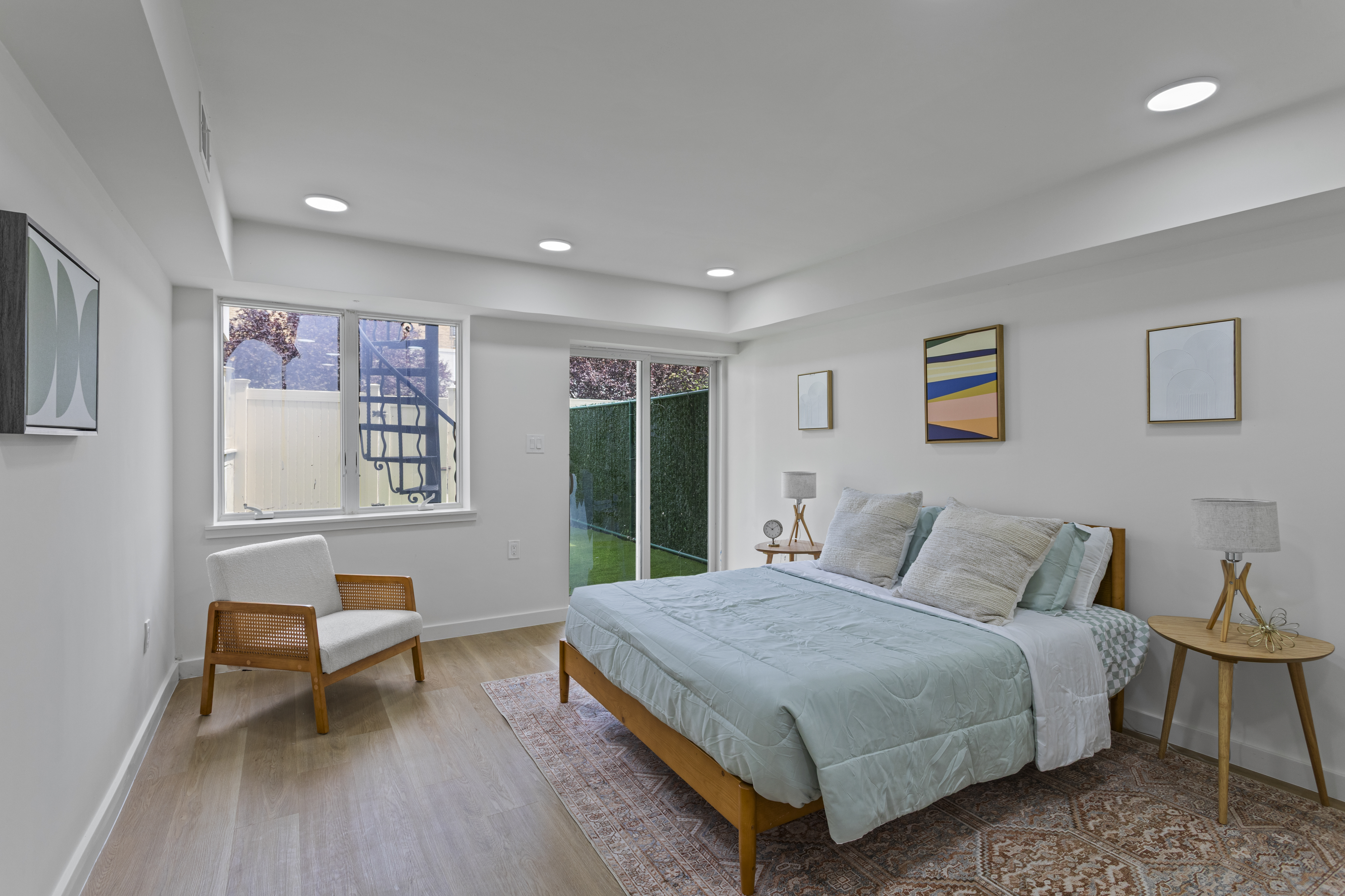 3112 Emmons Avenue, Unit 3140A-2 Brooklyn, NY 11235 - Photo 7 of 13 a bedroom with a bed and chair