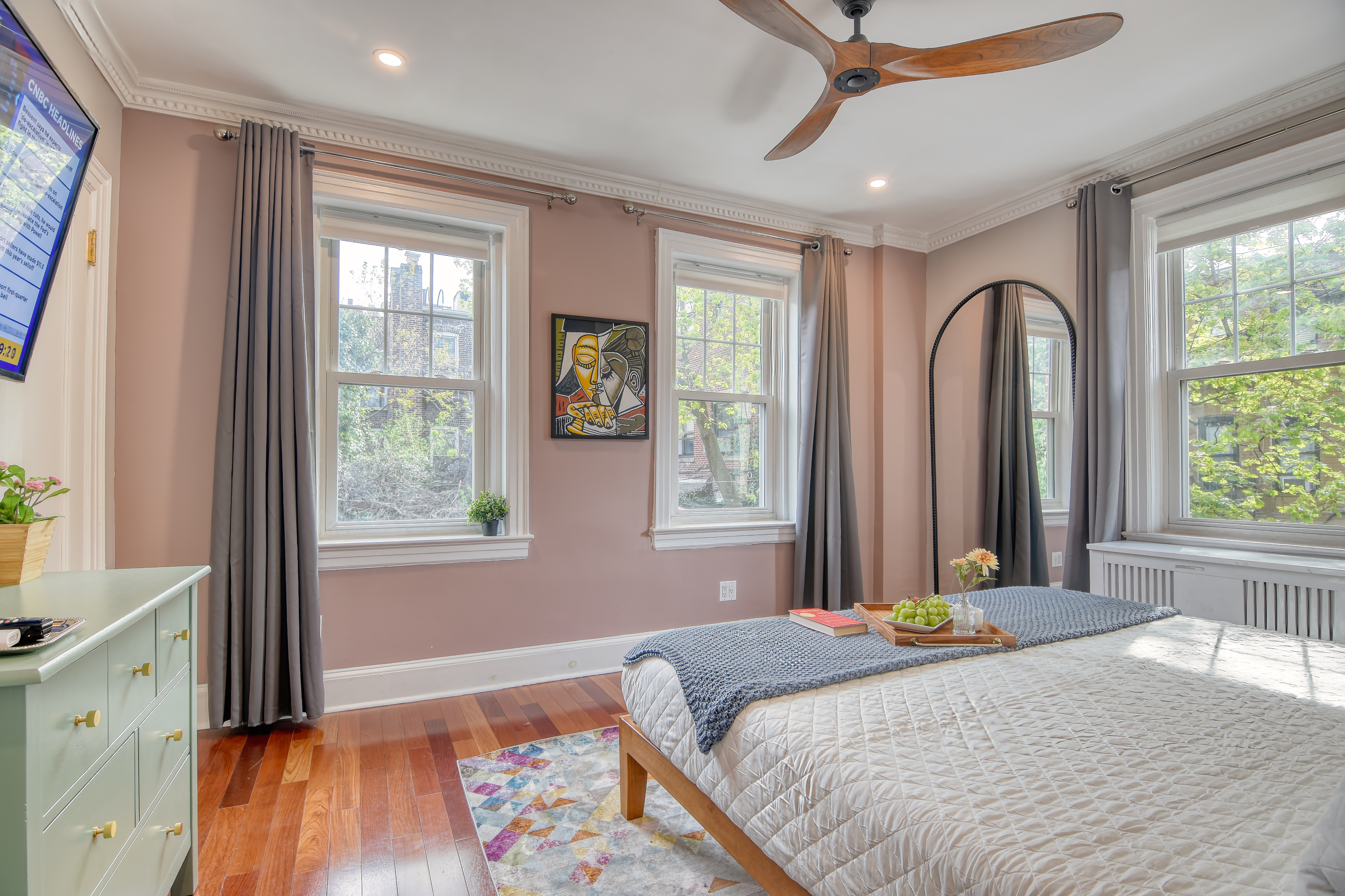 232 Maple Street Brooklyn, NY 11225 - Photo 5 of 16 a bedroom with a bed and a large window