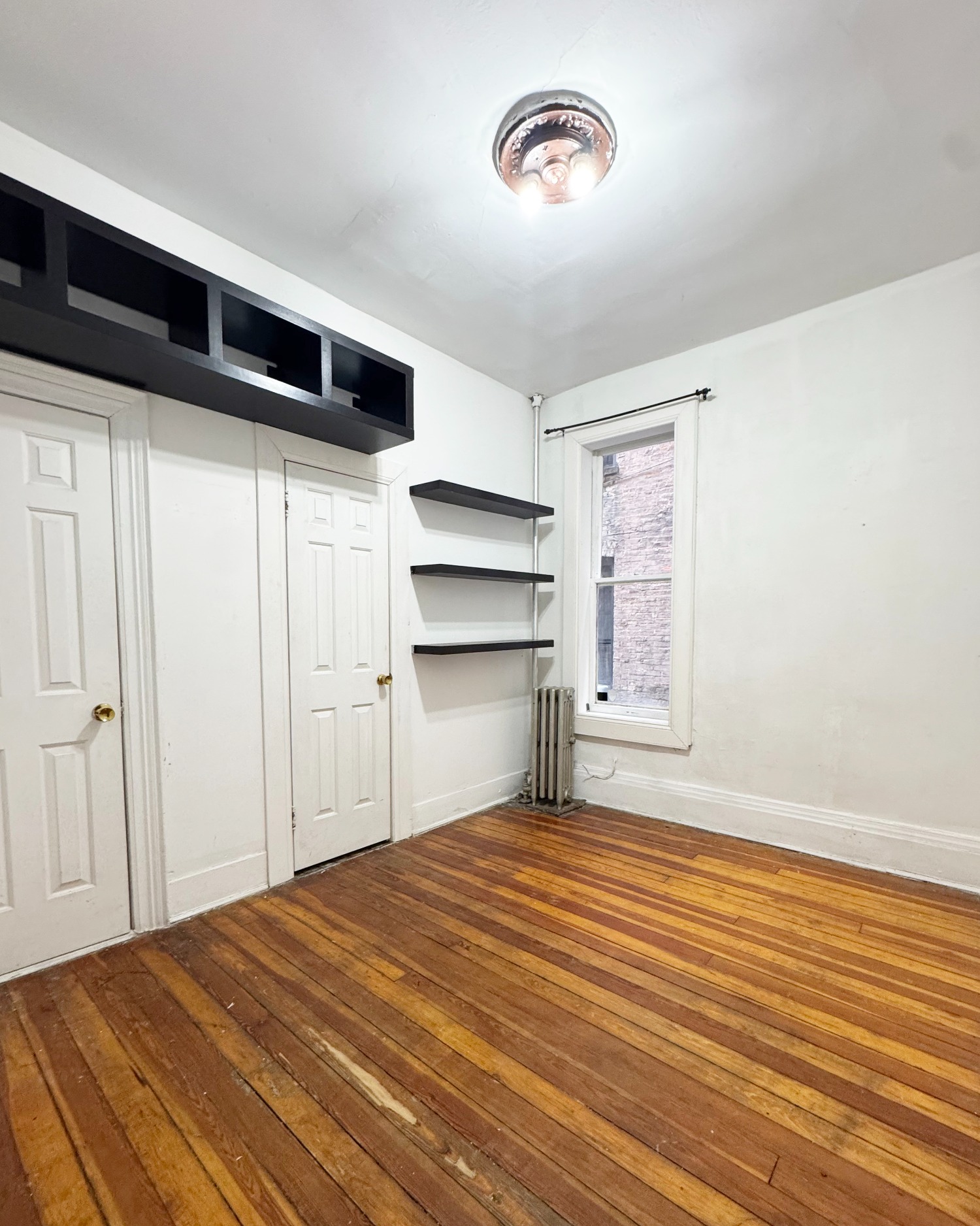 562 7th Street, Unit 3 Brooklyn, NY 11215 - Photo 5 of 6 a bedroom with a bed and a ceiling fan