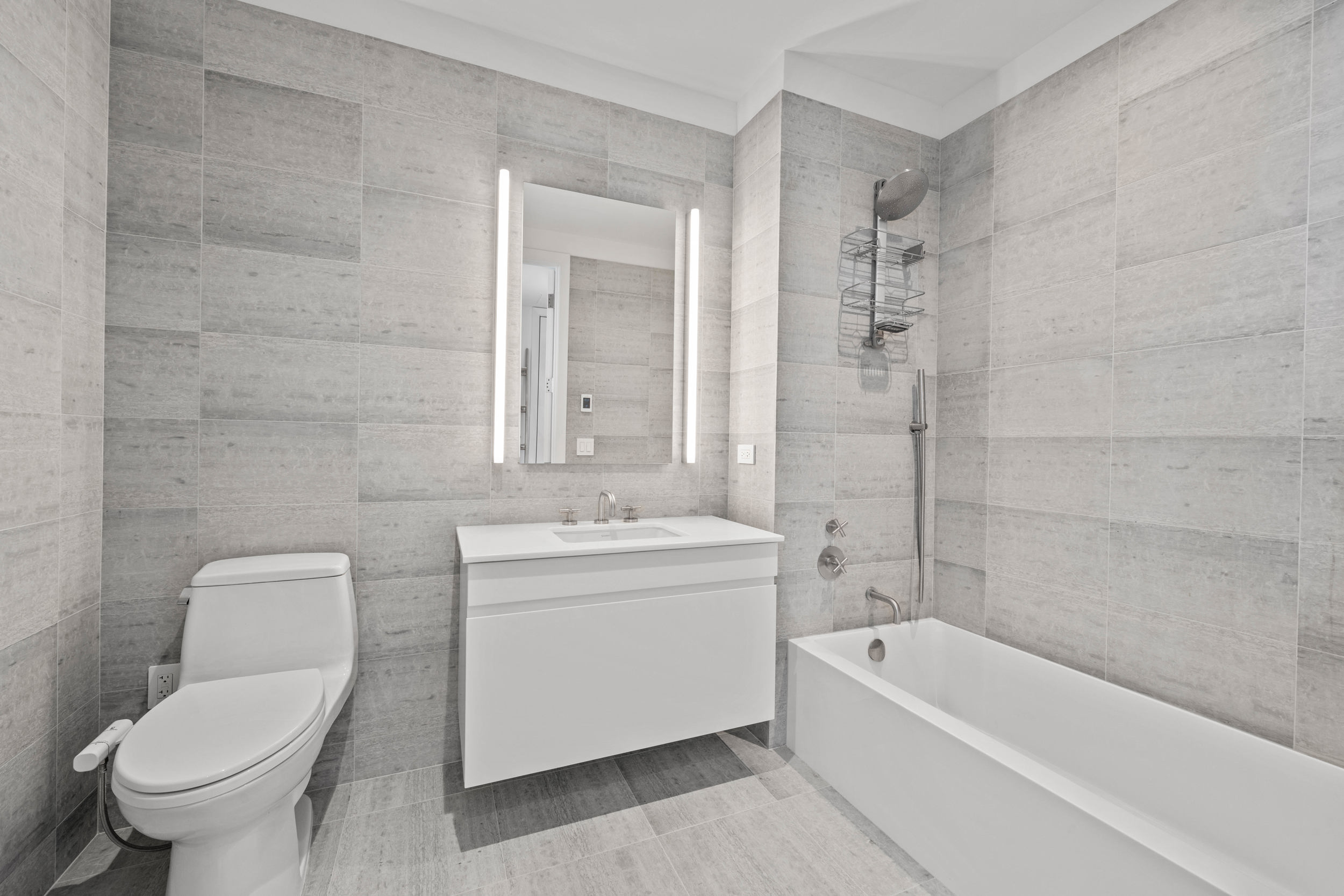 8 South 4th Street, Unit 15D Brooklyn, NY 11249 - Photo 10 of 29 a bathroom with a toilet a sink and bathtub