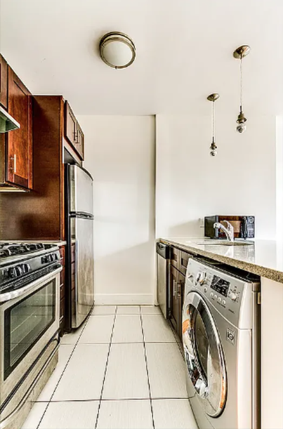 406 Monroe Street, Unit 3 Brooklyn, NY 11221 - Photo 9 of 11 a kitchen with a stove top oven and refrigerator