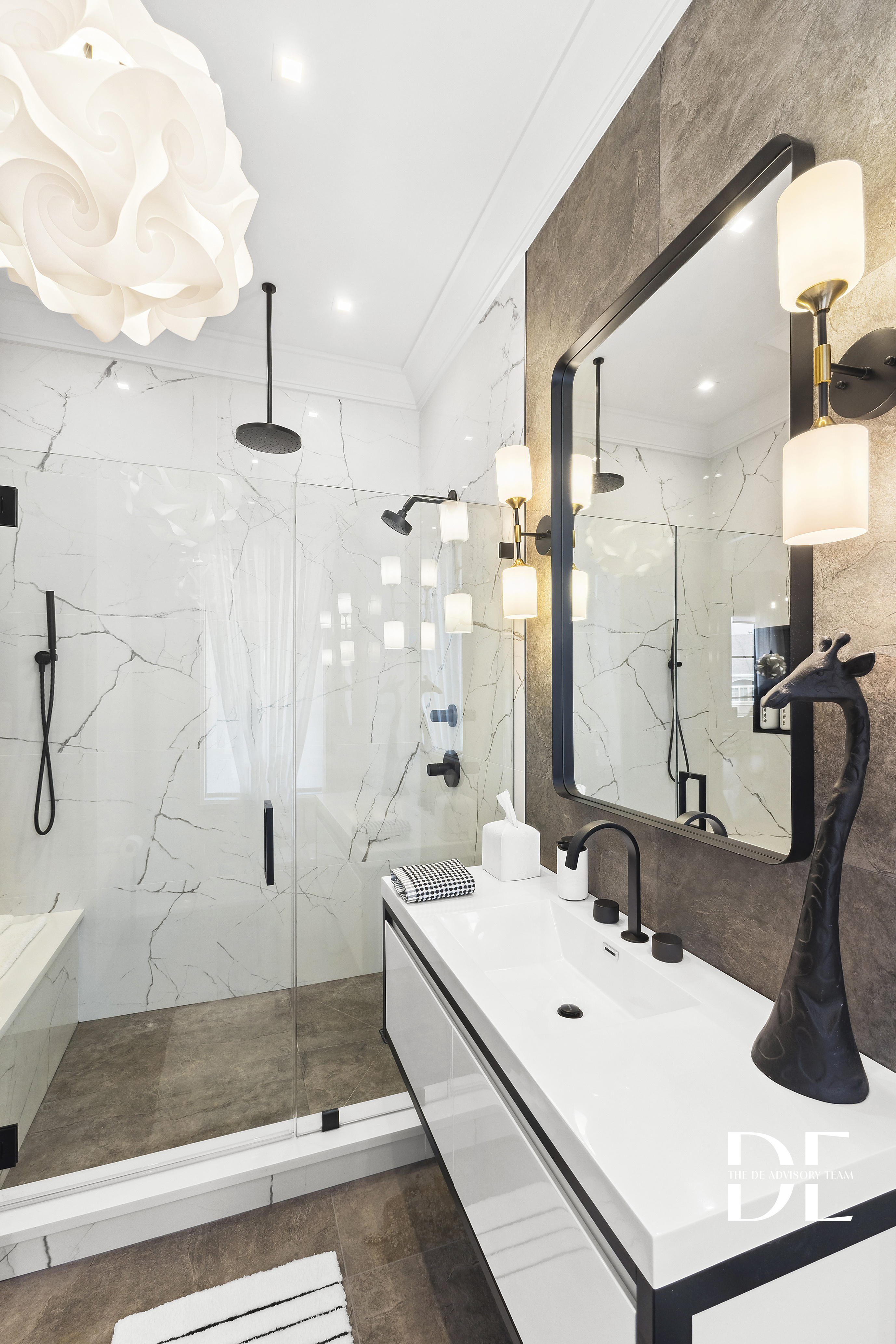 52 Nicolosi Loop Staten Island, NY 10312 - Photo 14 of 23 a bathroom with a sink a mirror and a shower